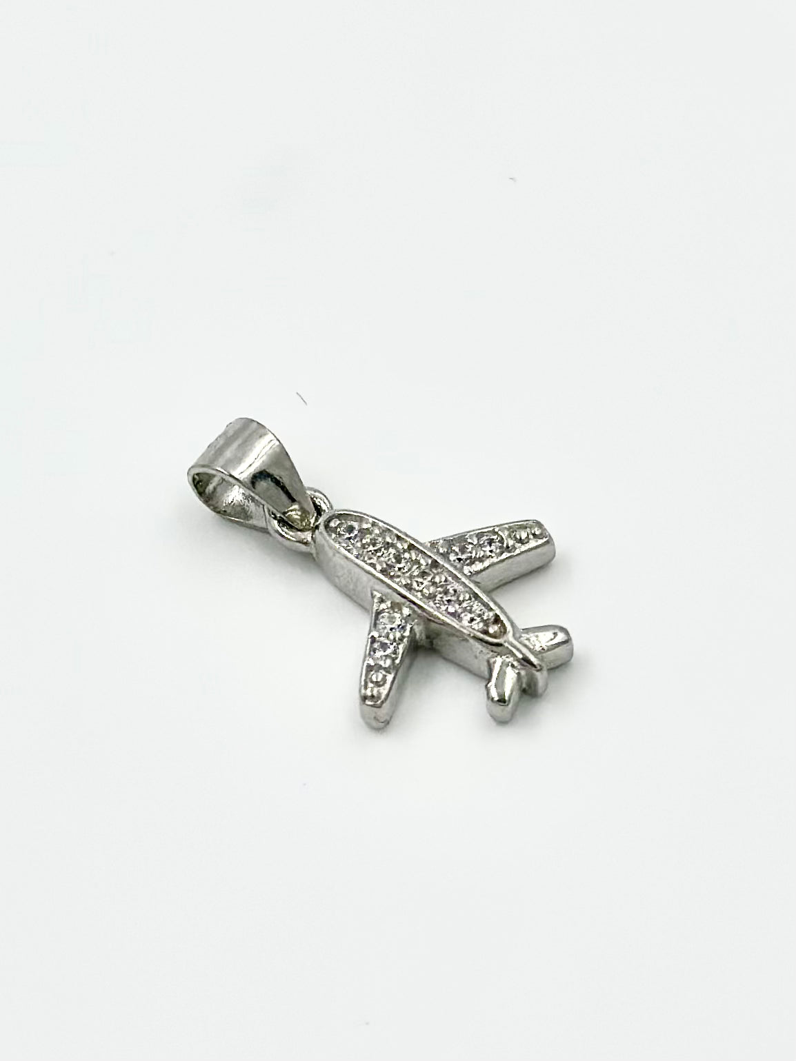 Aeroplane shaped, zircon studded sterling silver pendant