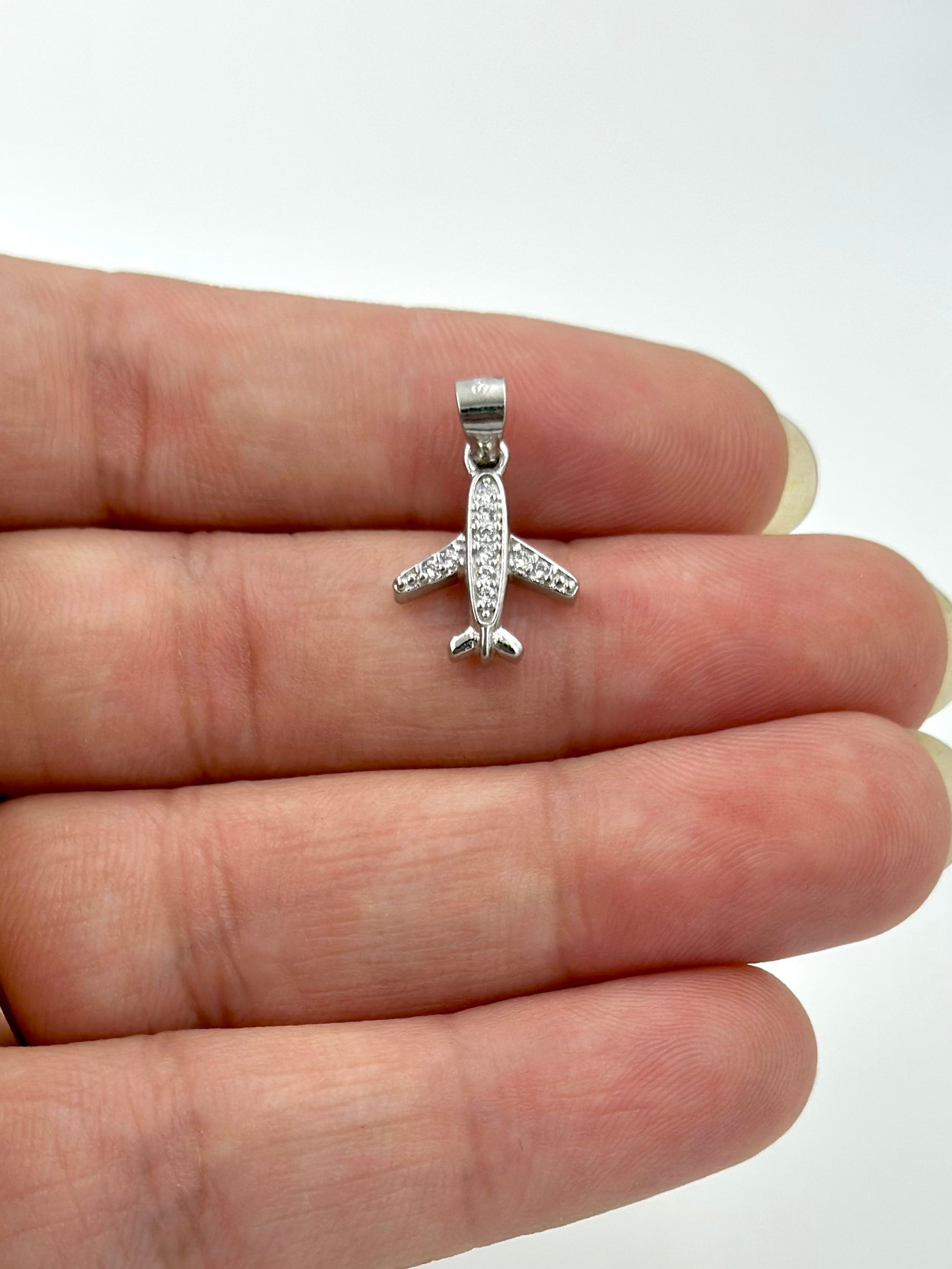 Aeroplane shaped, zircon studded sterling silver pendant