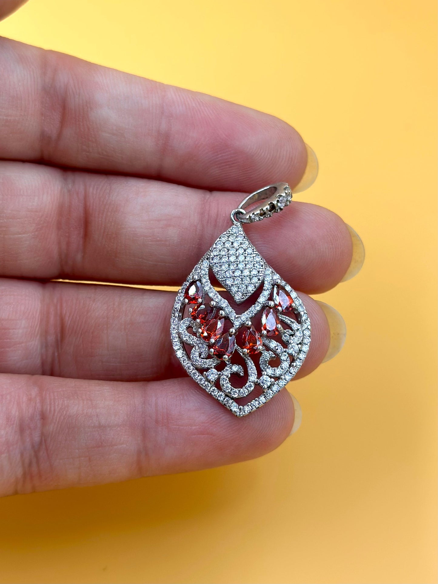 Zircon studded with fancy stones, double leaf shaped sterling silver pendant