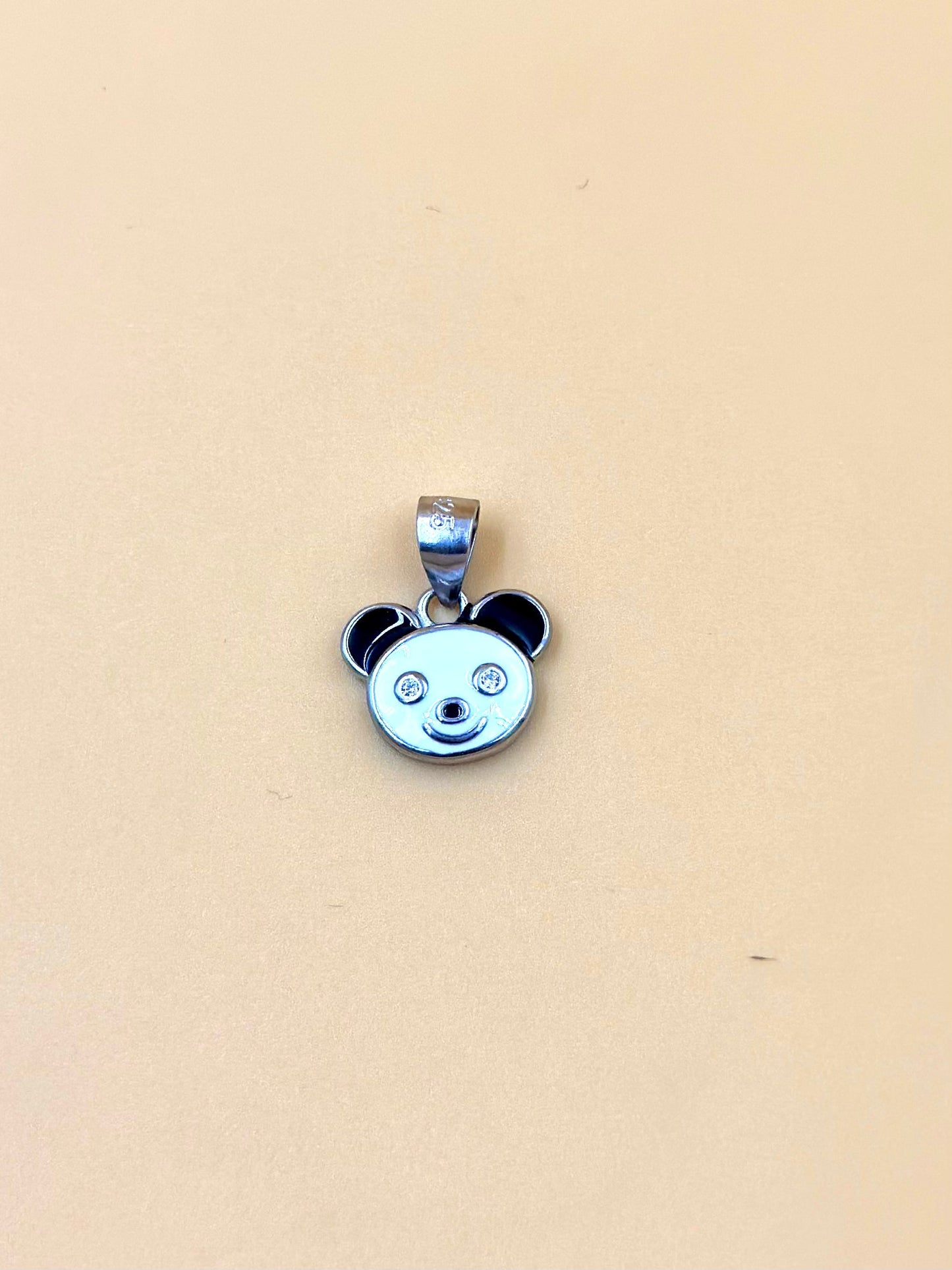 Zircon studded, enamel coated, panda shaped sterling silver pendant