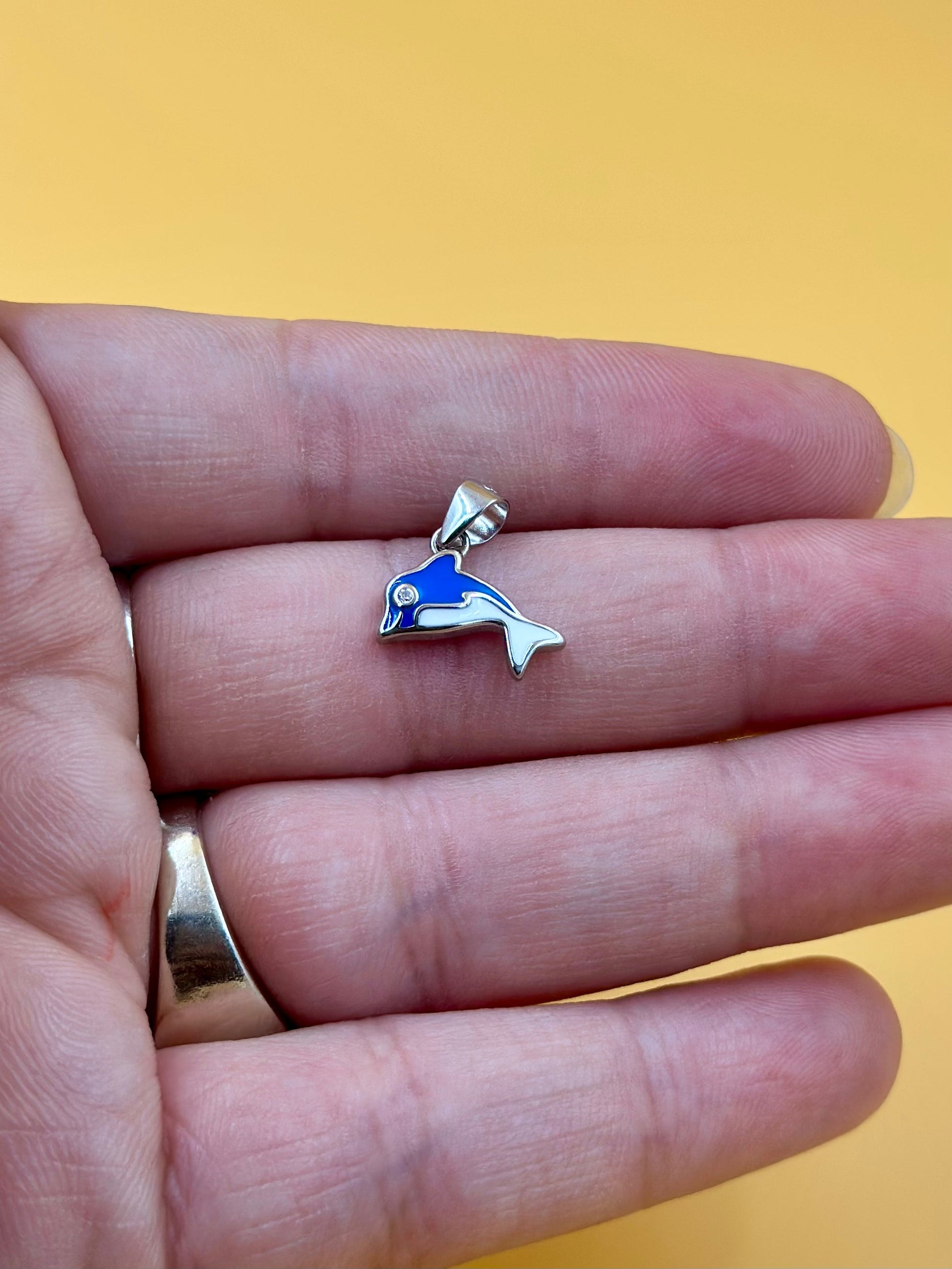 Zircon studded, enamel coated, dolphin shaped sterling silver pendant