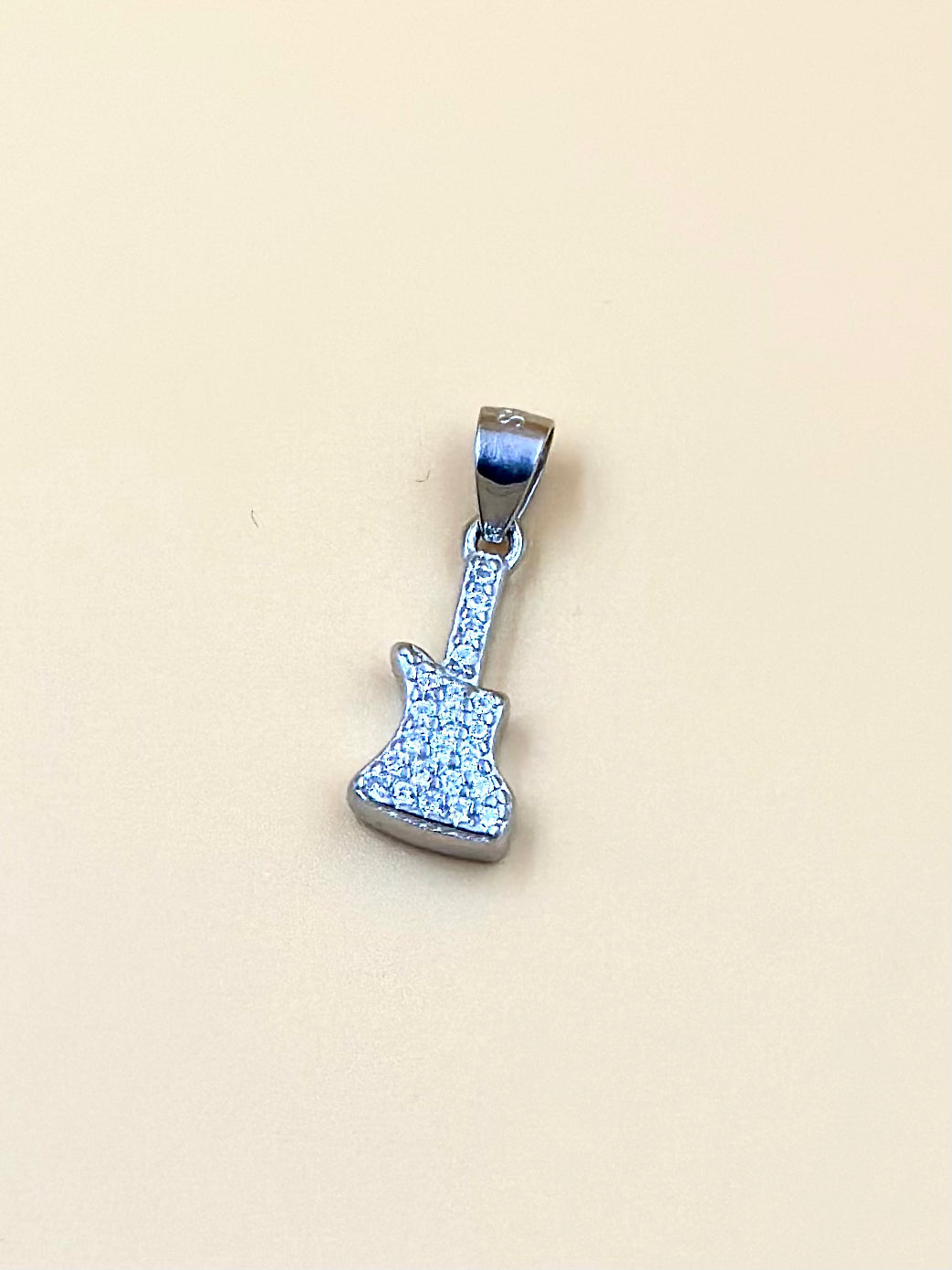Zircon studded, guitar shaped sterling silver pendant