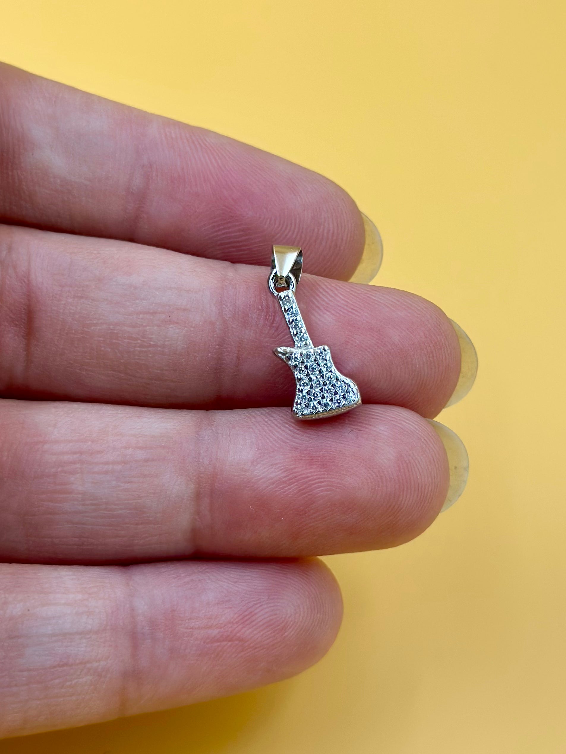 Zircon studded, guitar shaped sterling silver pendant