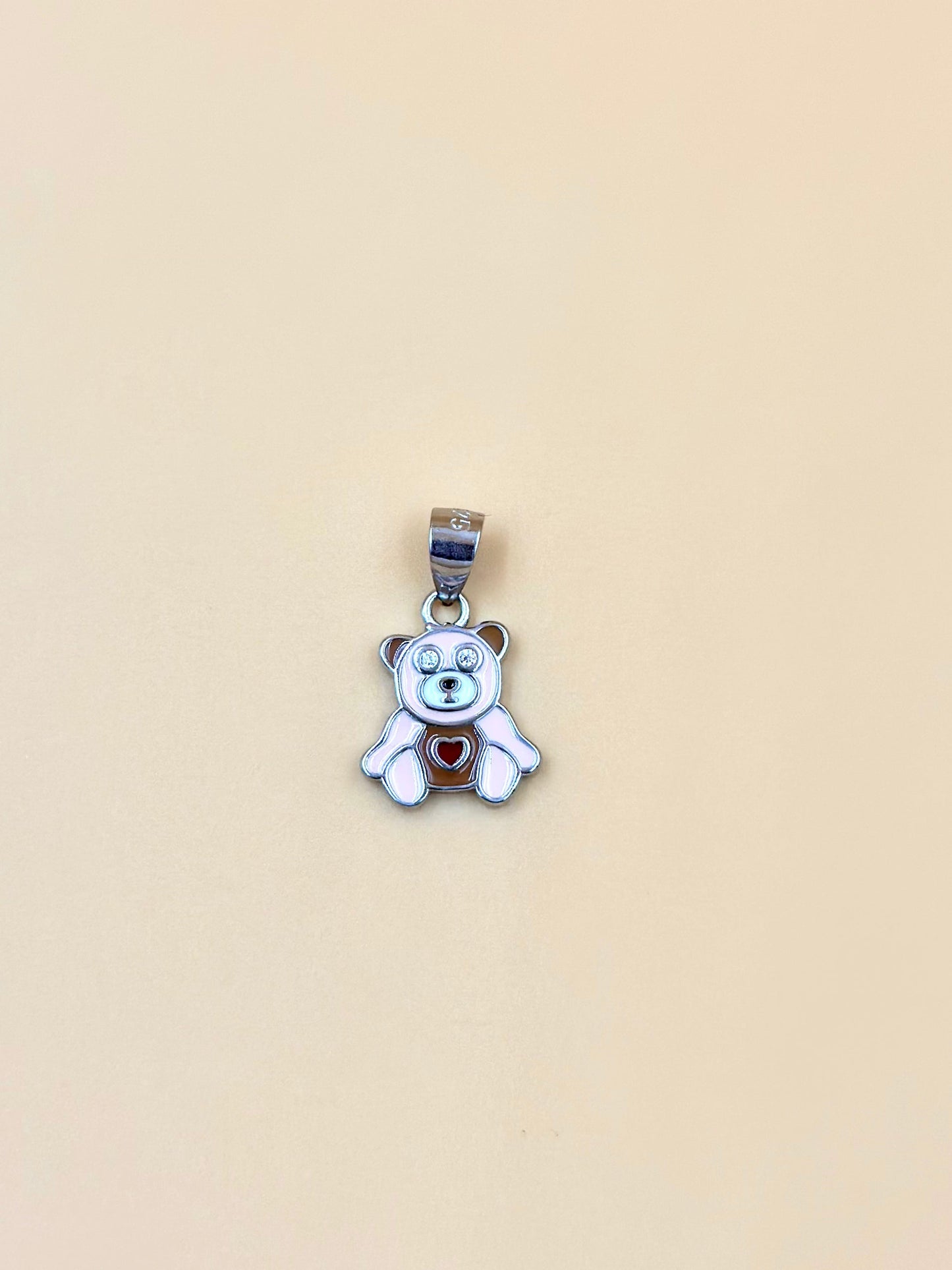 Zircon studded, enamel coated, teddy bear shaped sterling silver pendant