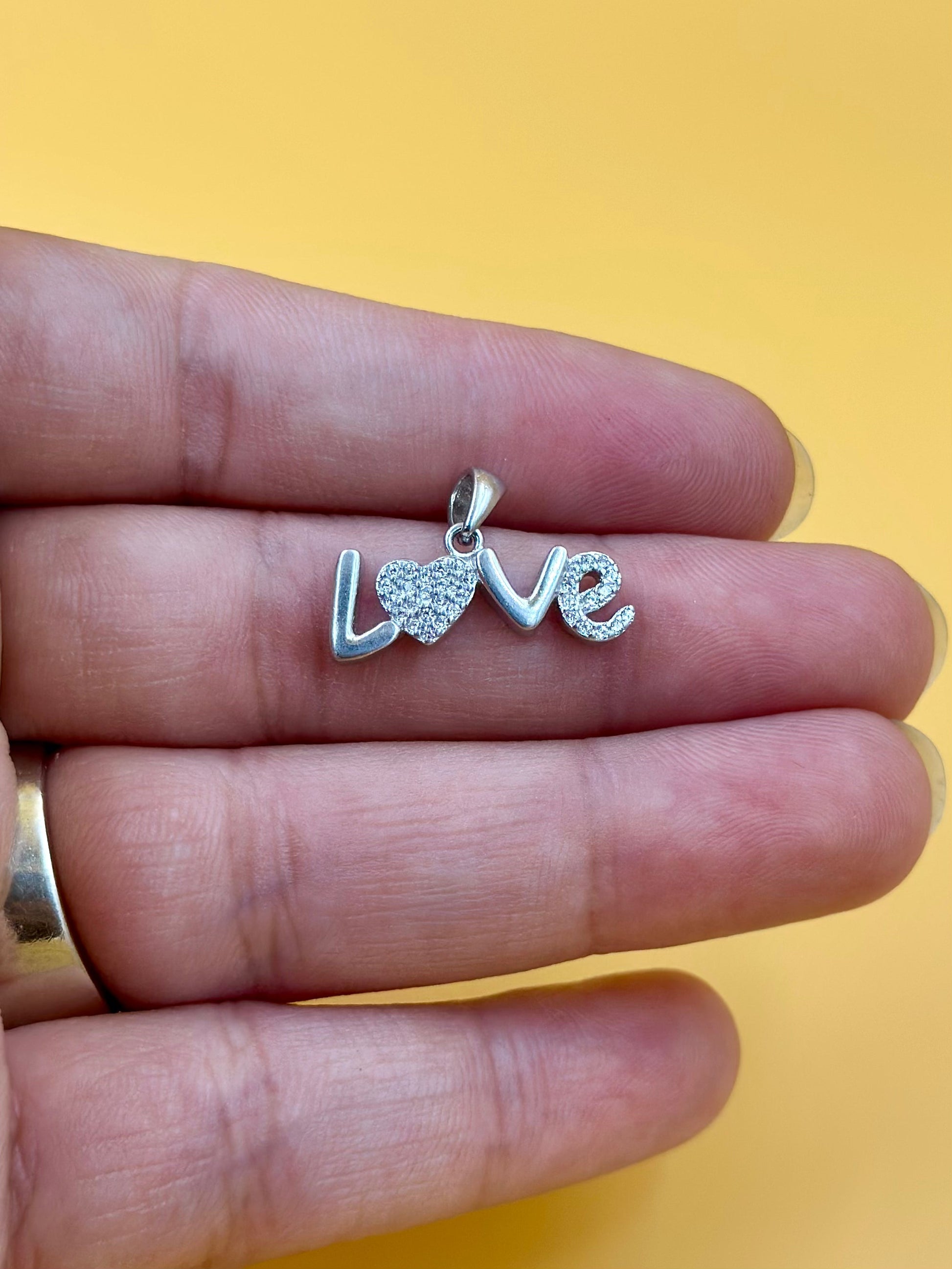 Zircon studded sterling silver pendant