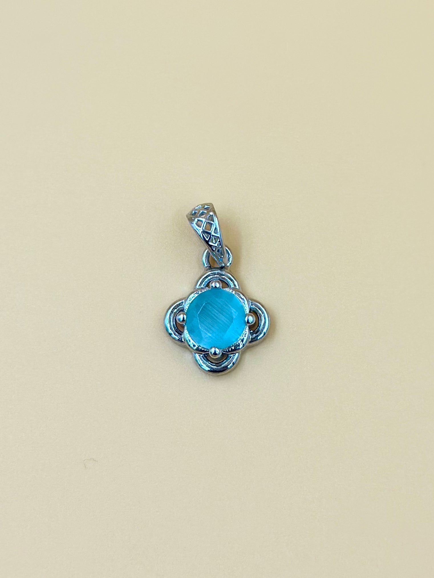 Fancy stone studded sterling silver pendant