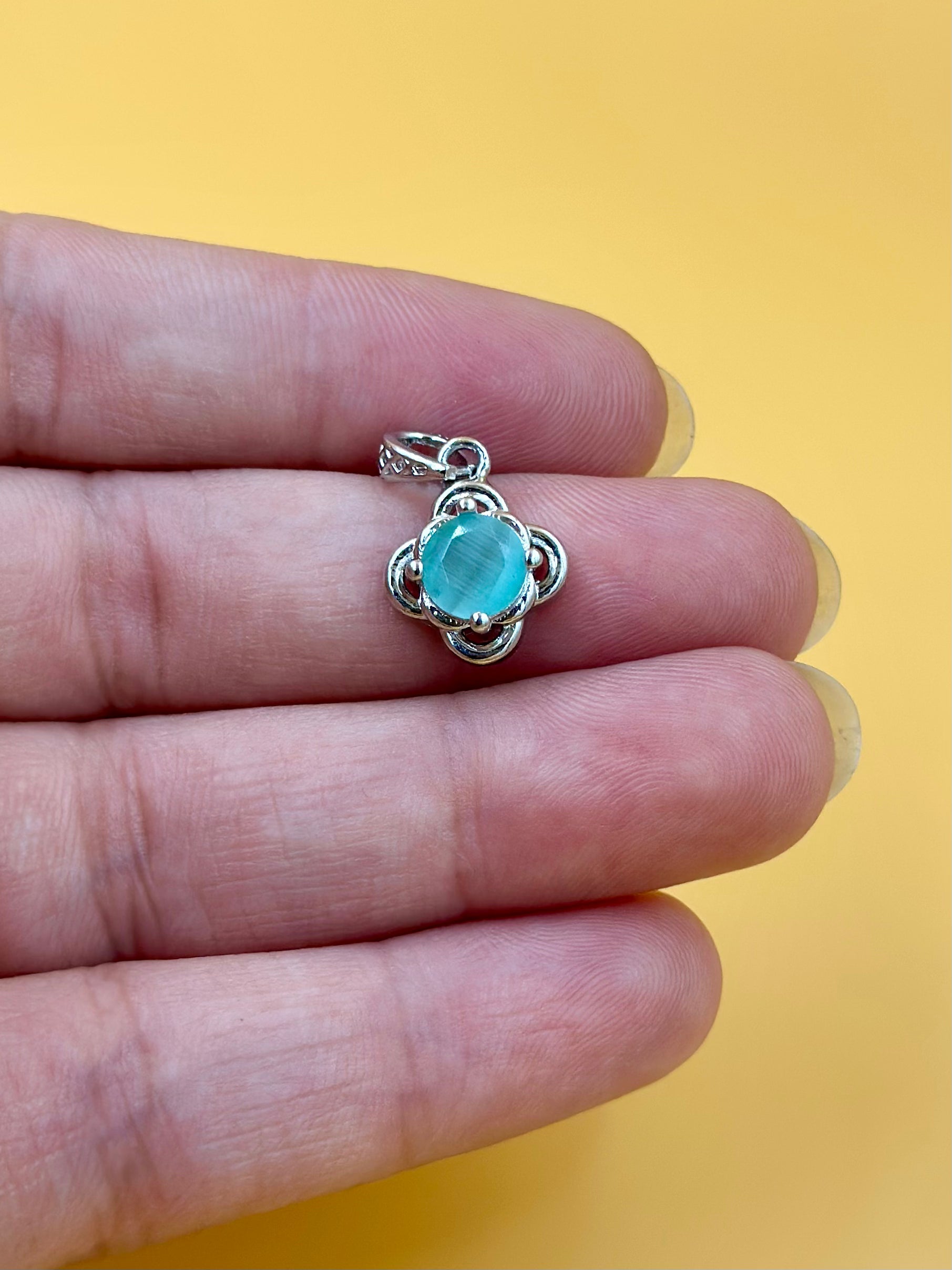 Fancy stone studded sterling silver pendant