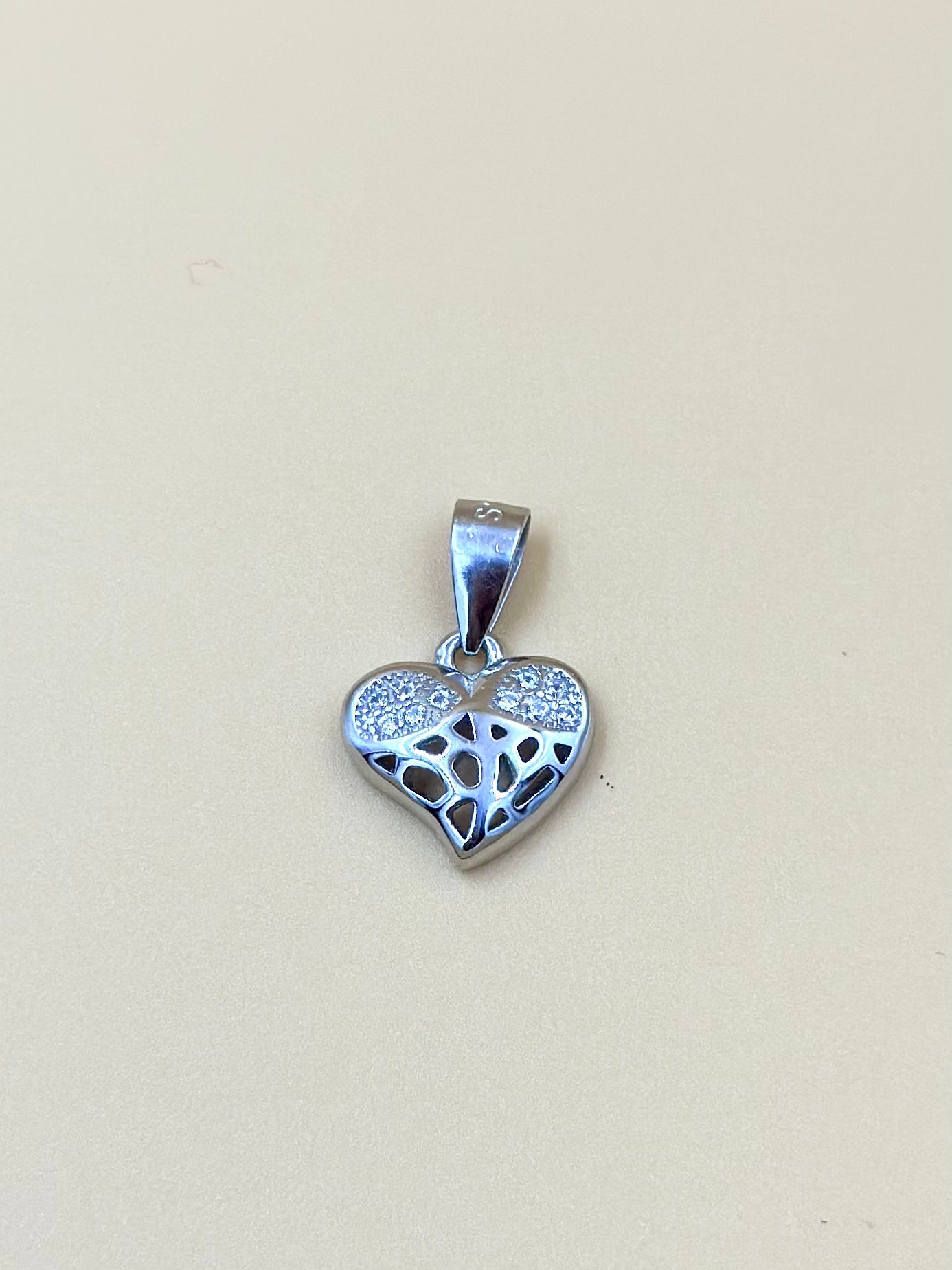 Zircon studded with fine detailing, heart shaped sterling silver pendant