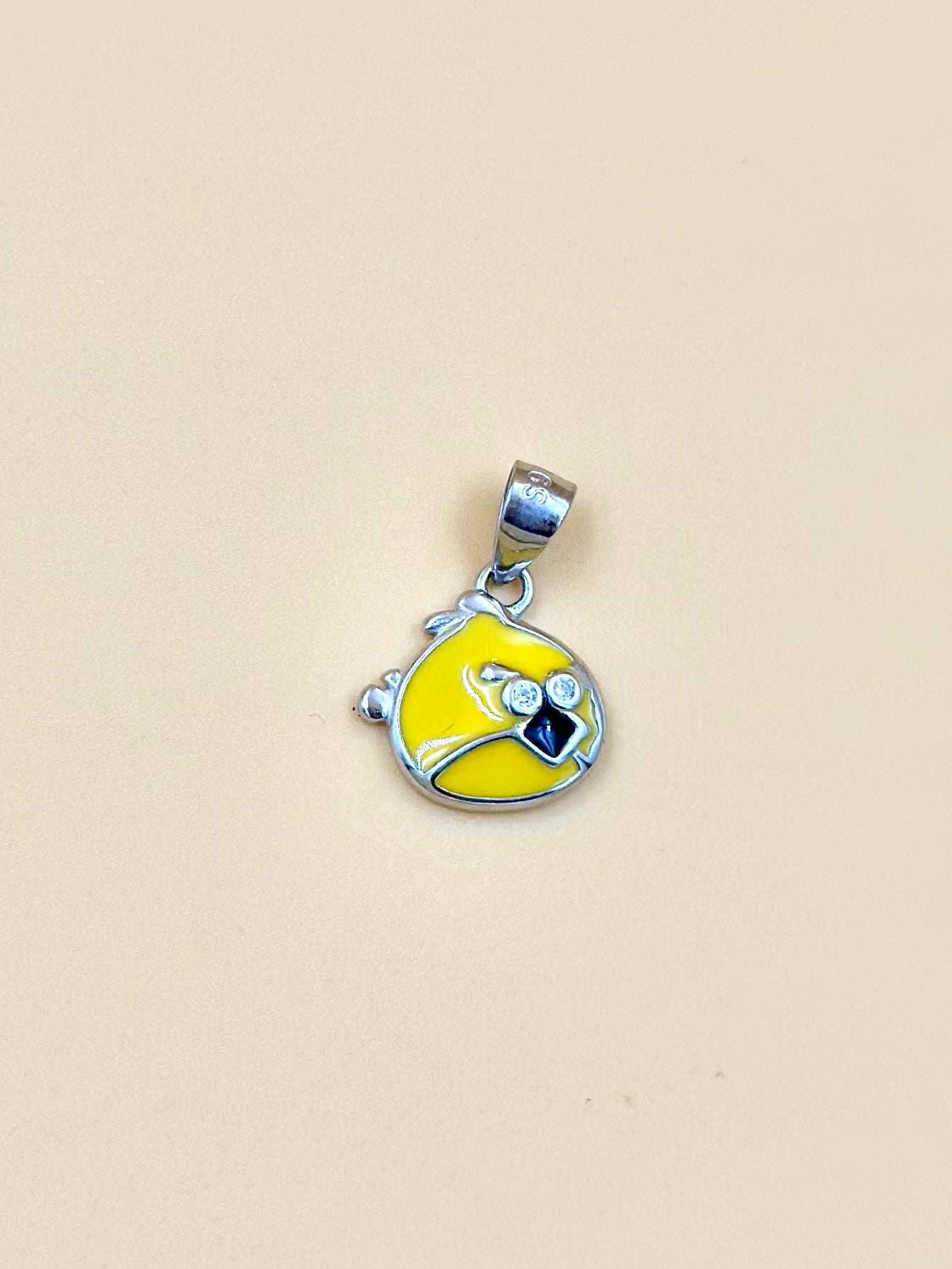 Zircon studded, enamel coated, angry bird shaped sterling silver pendant