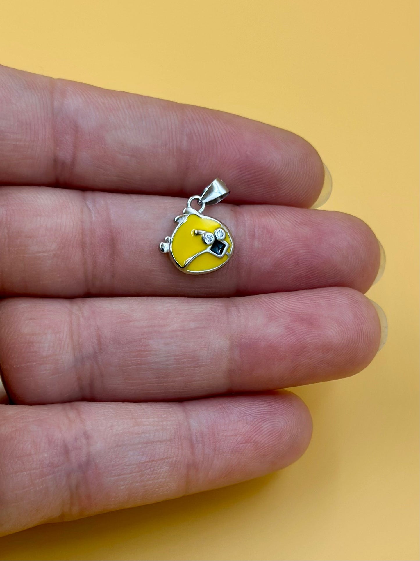 Zircon studded, enamel coated, angry bird shaped sterling silver pendant