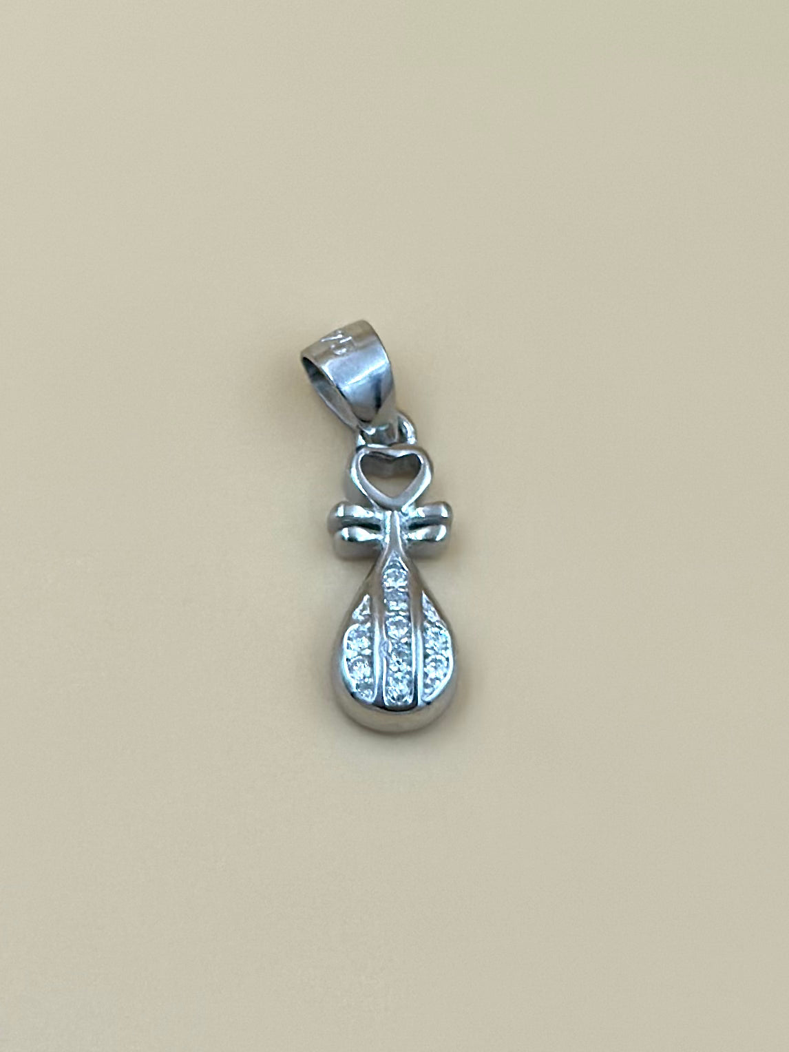Zircon studded, key shaped sterling silver pendant