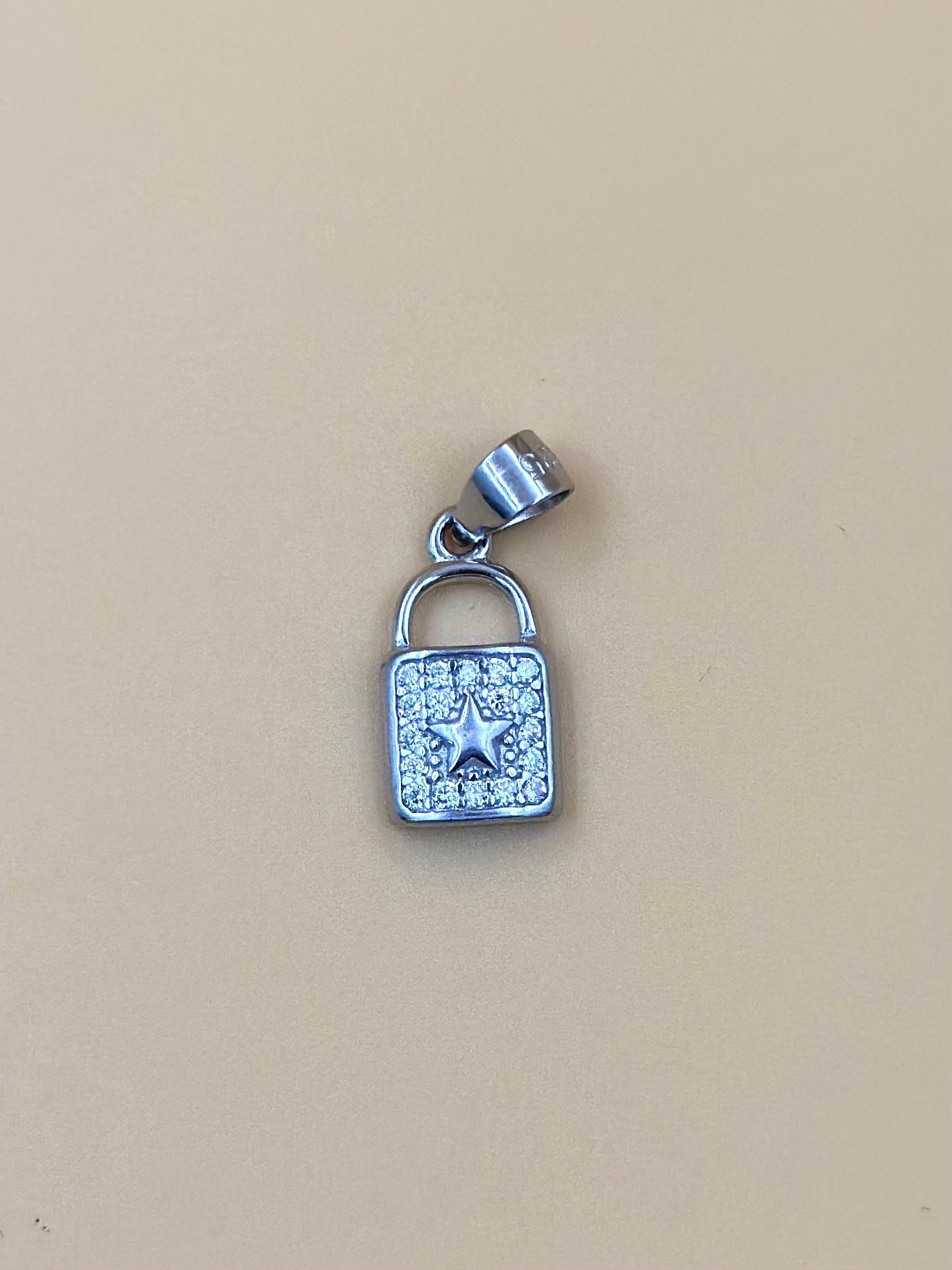 Zircon studded, lock shaped sterling silver pendant