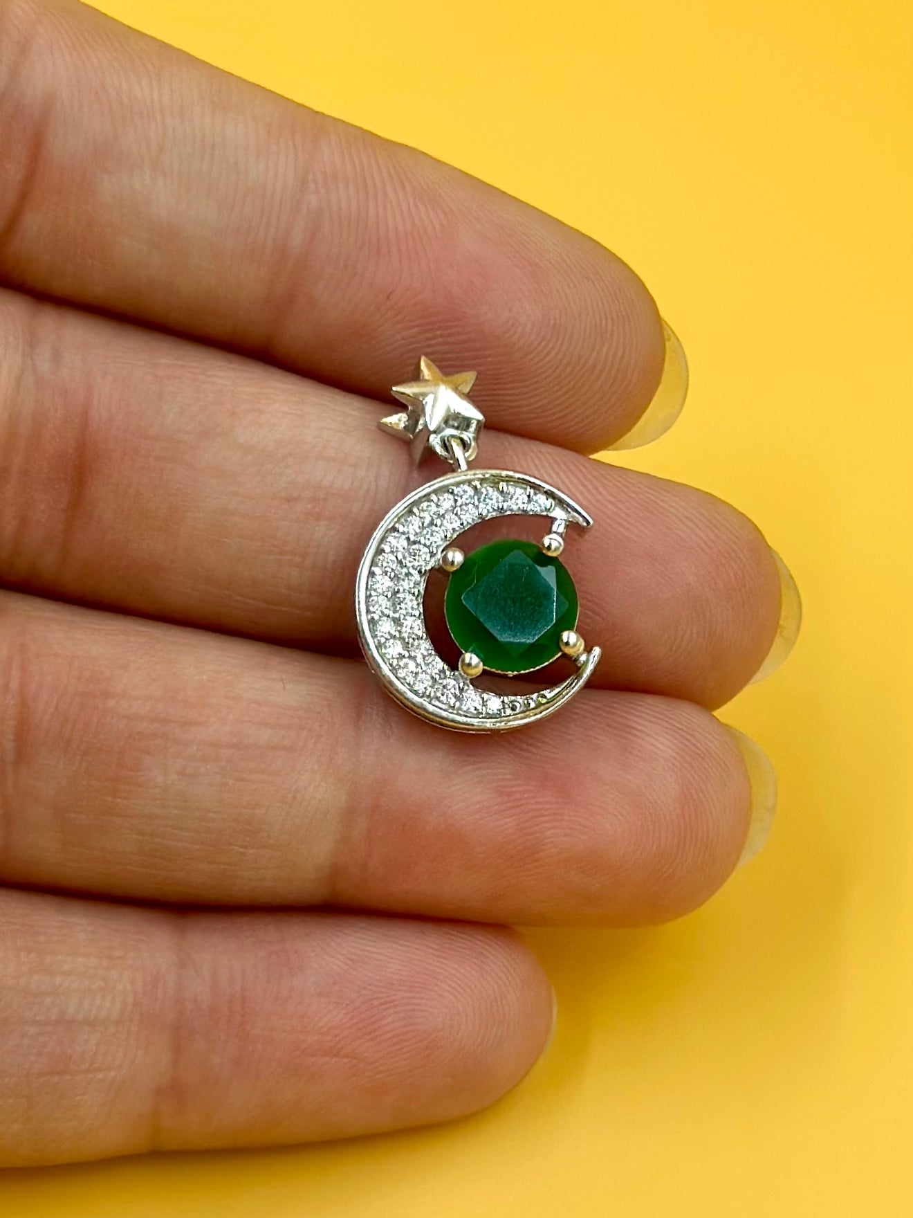 Zircon studded, enamel coated, half moon shaped sterling silver pendant