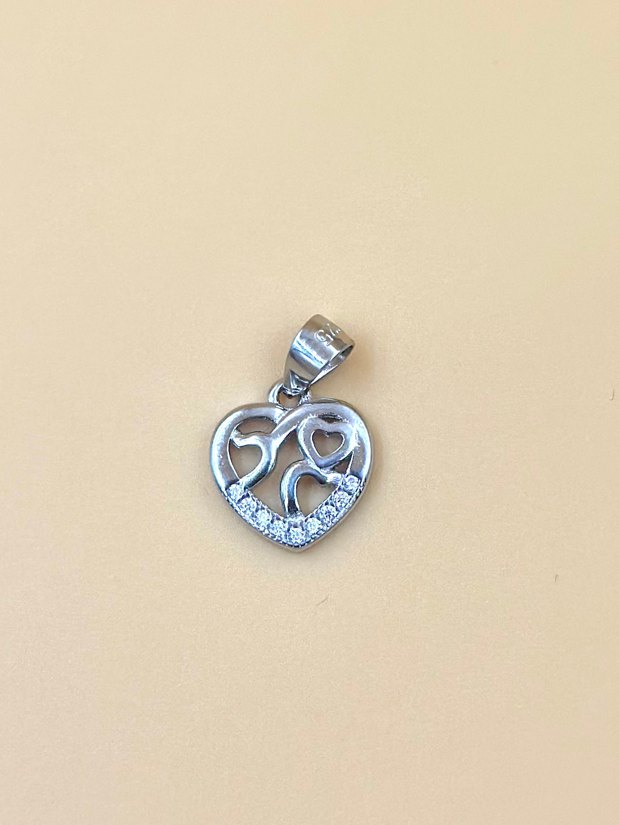 Zircon studded, heart shaped sterling silver pendant