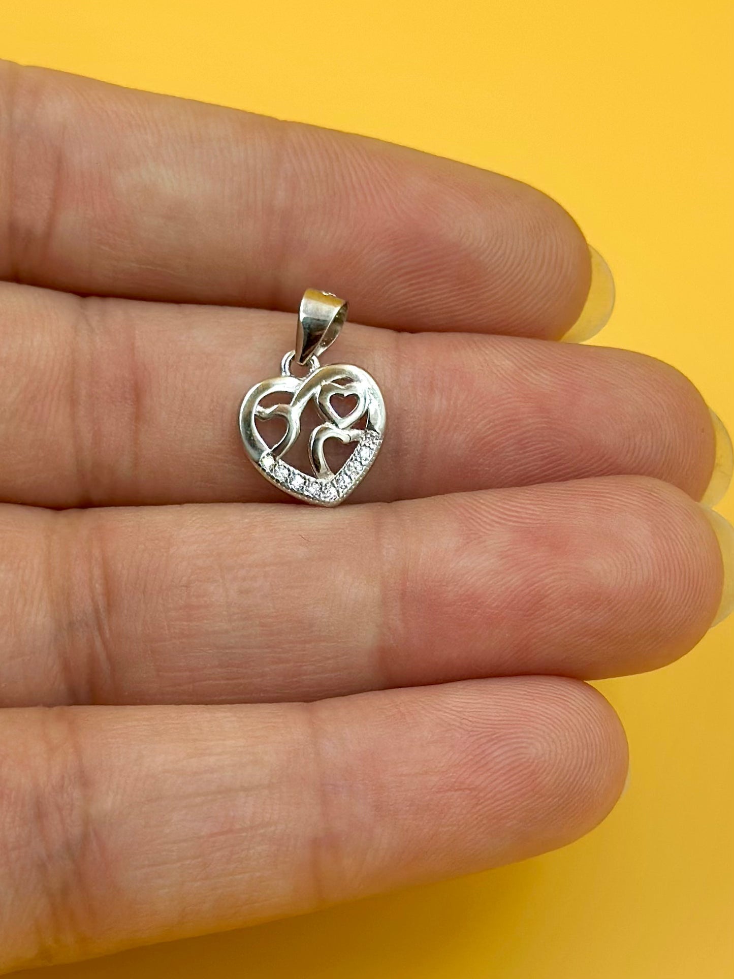 Zircon studded, heart shaped sterling silver pendant