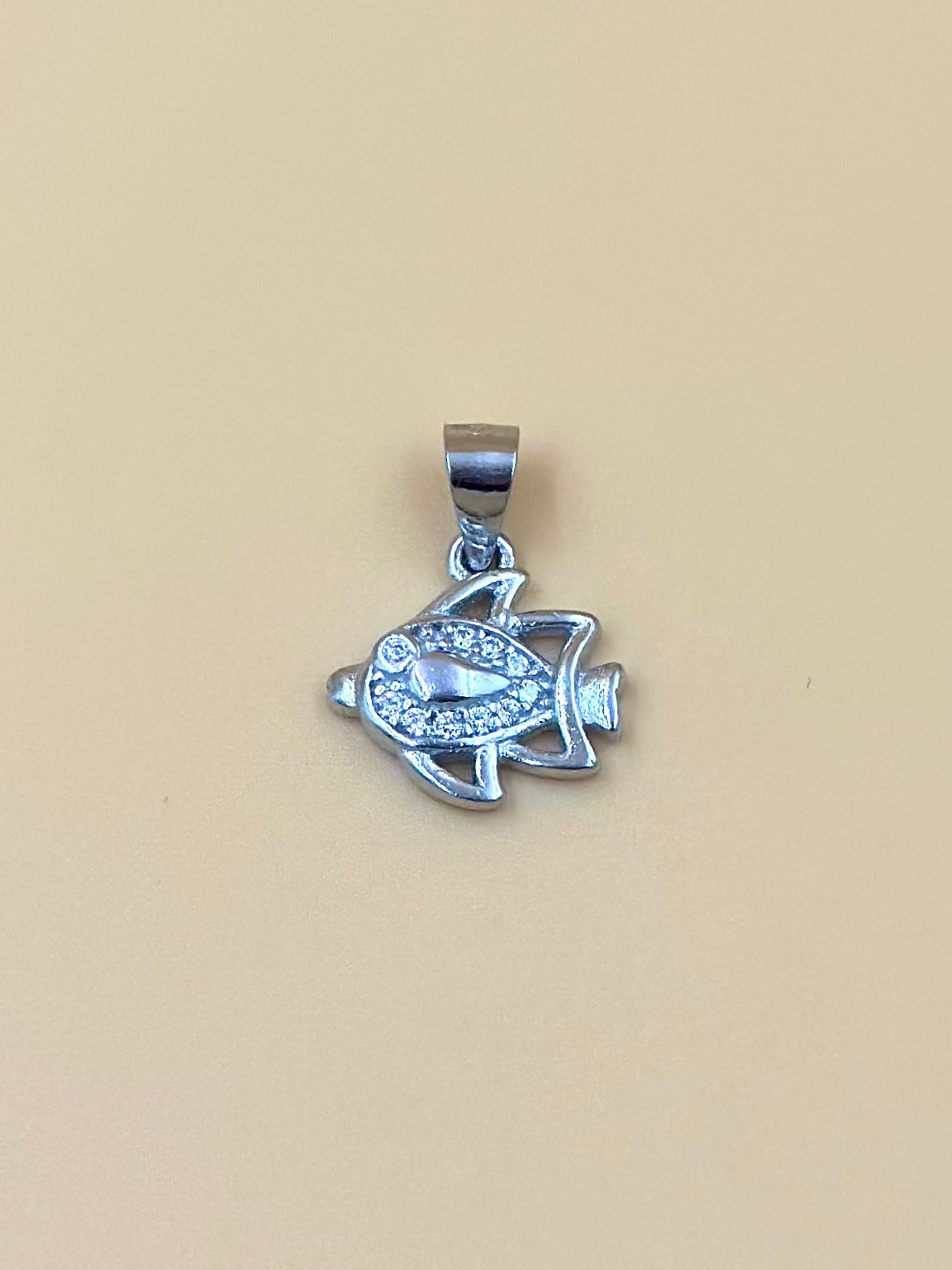 Zircon studded, fish shaped sterling silver pendant