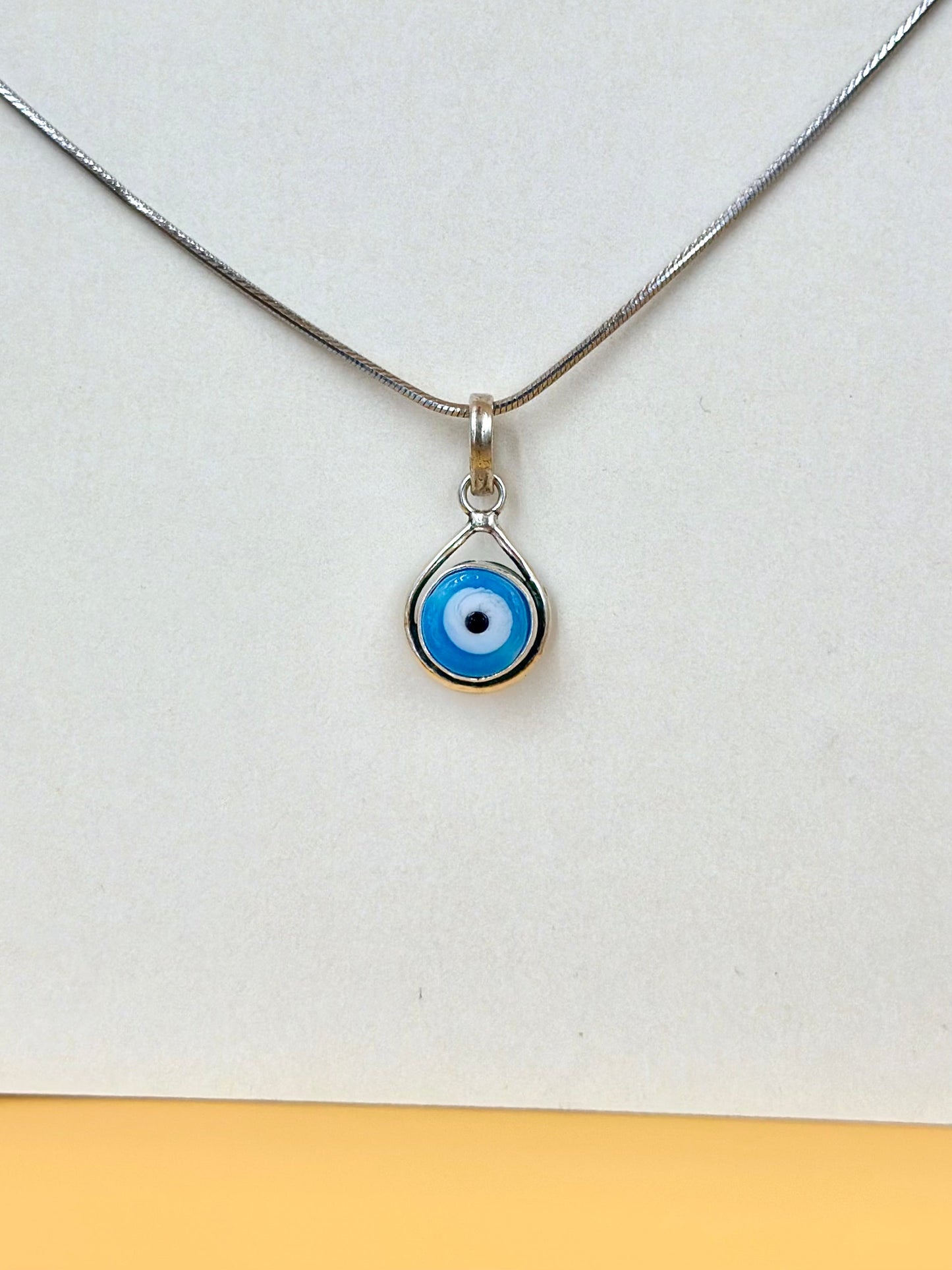 Enamel coated, evil eye sterling silver pendant
