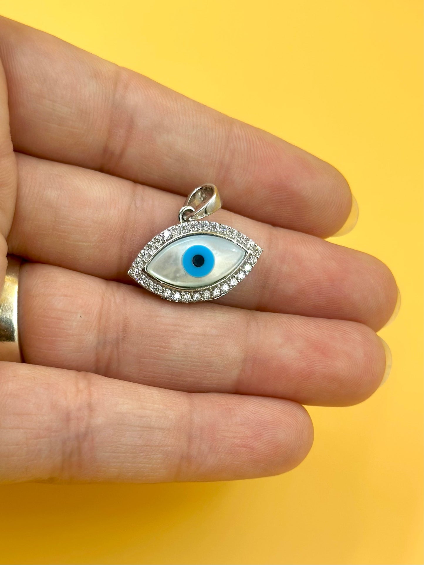 Zircon studded, enamel coated, evil eye sterling silver pendant