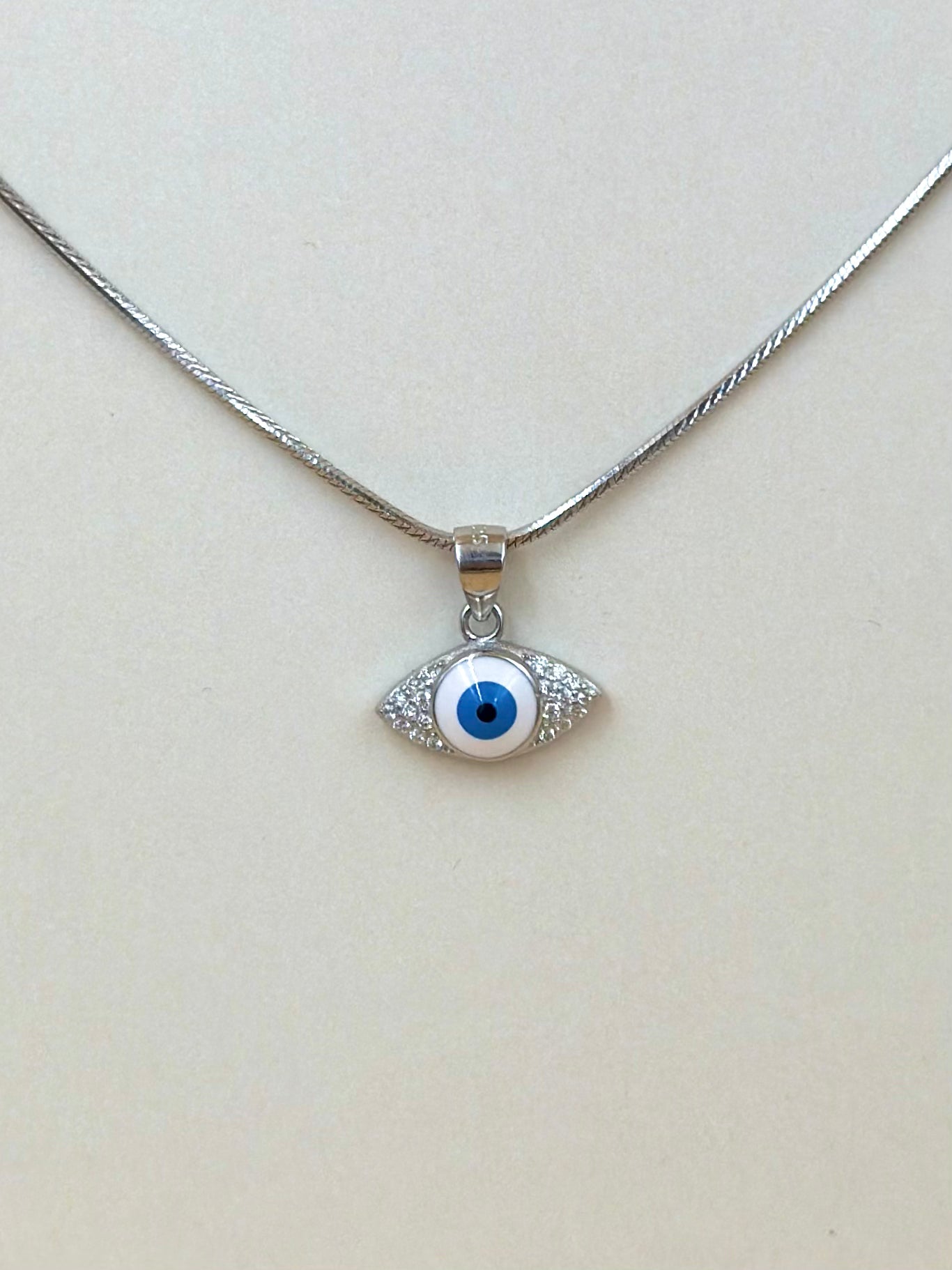 Zircon studded, enamel coated, evil eye sterling silver pendant