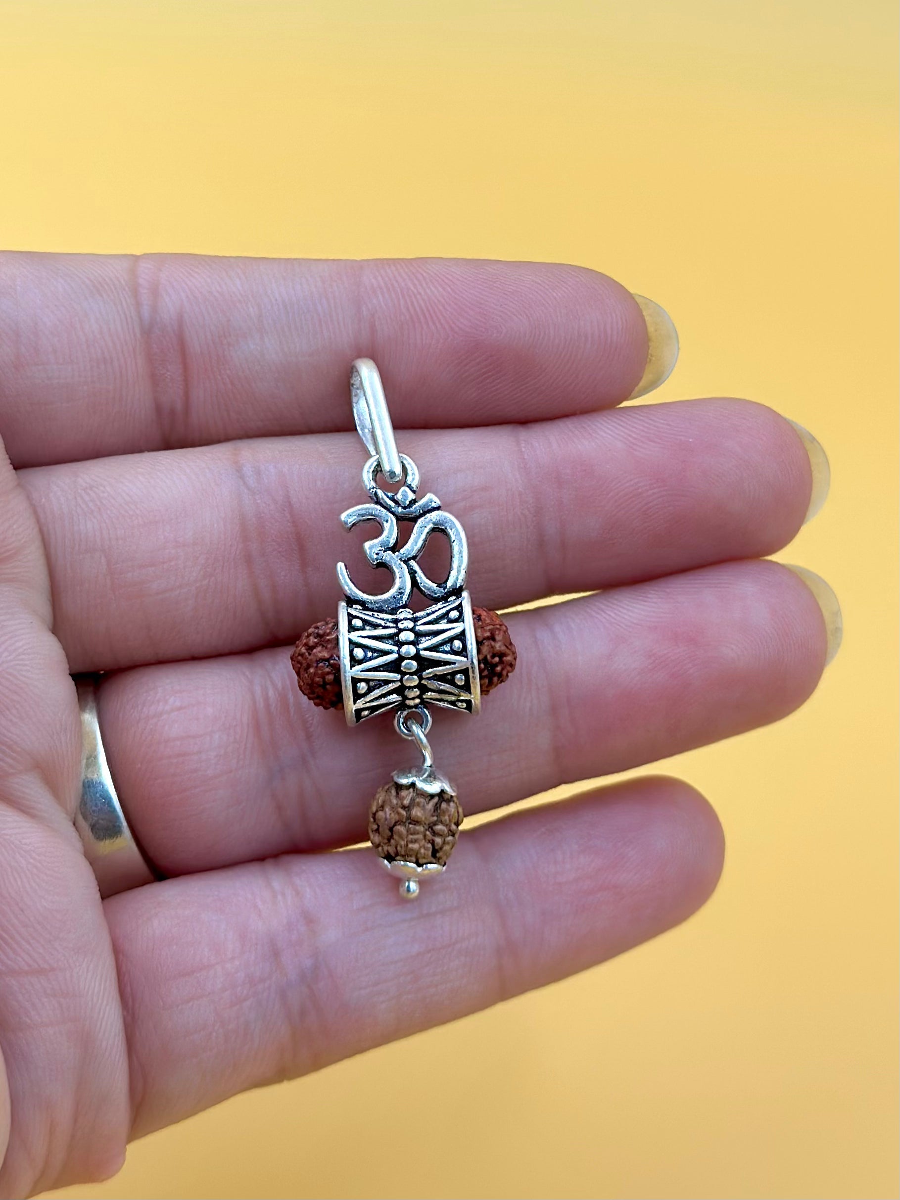 Oxidised, om shaped sterling silver idol pendant