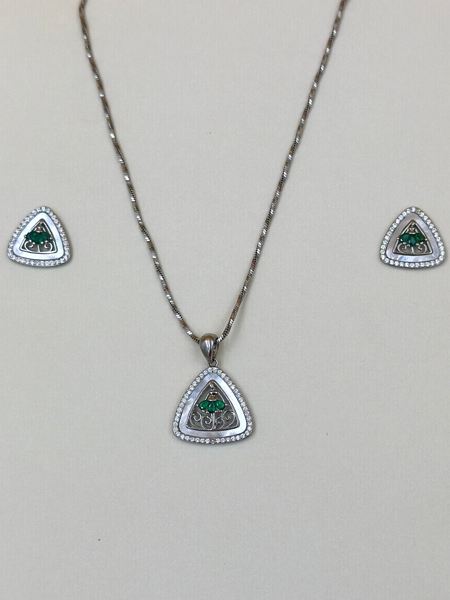 Triangle shaped, zircon studded sterling silver pendant set