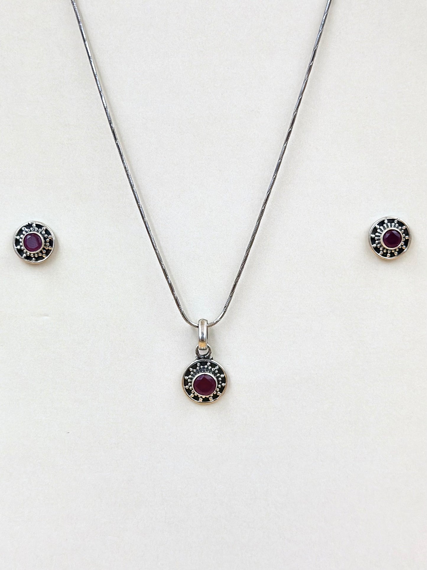 Ruby studded, oxidised sterling silver pendant set