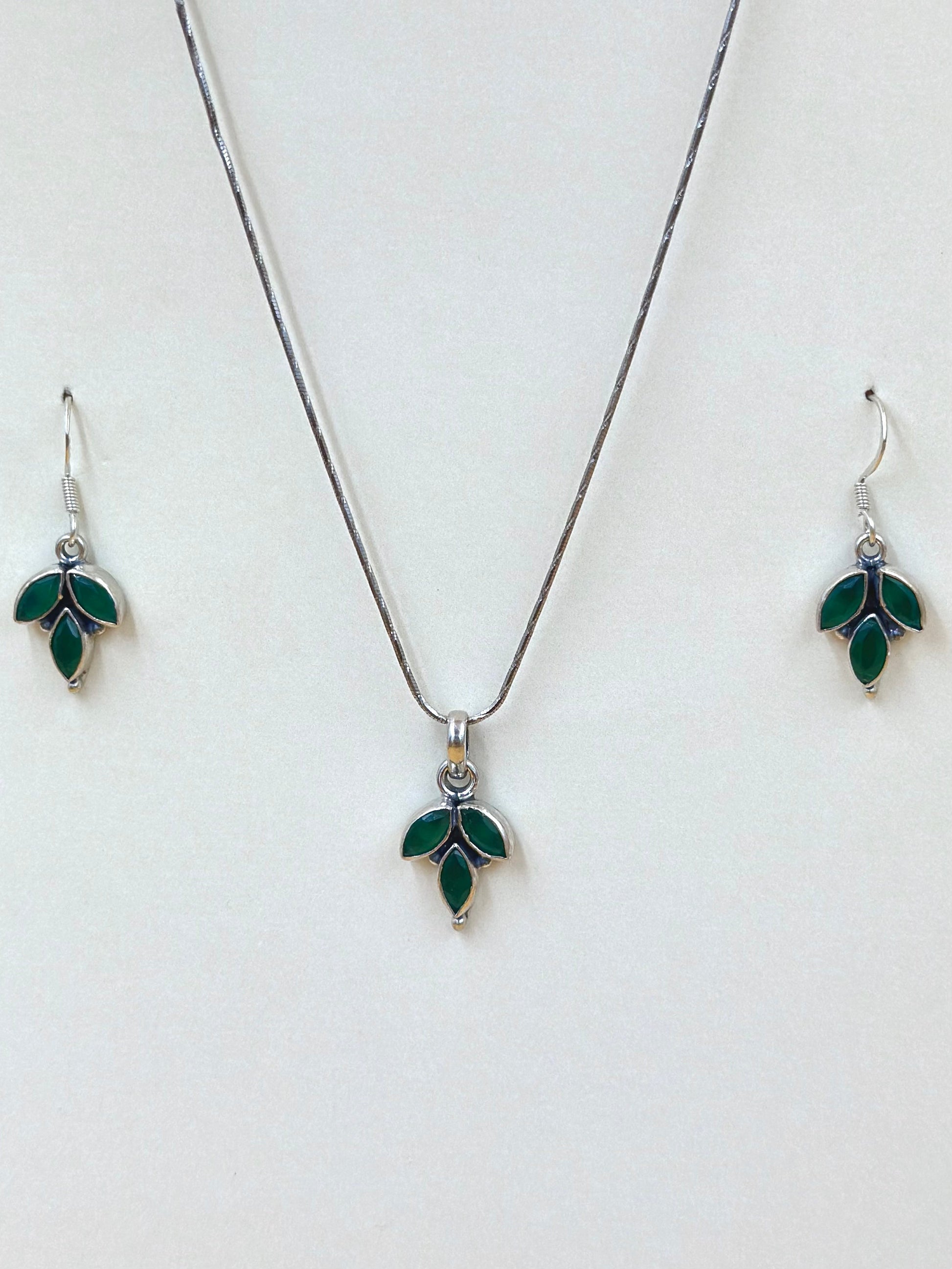 Stone studded, leaf shaped sterling silver pendant set