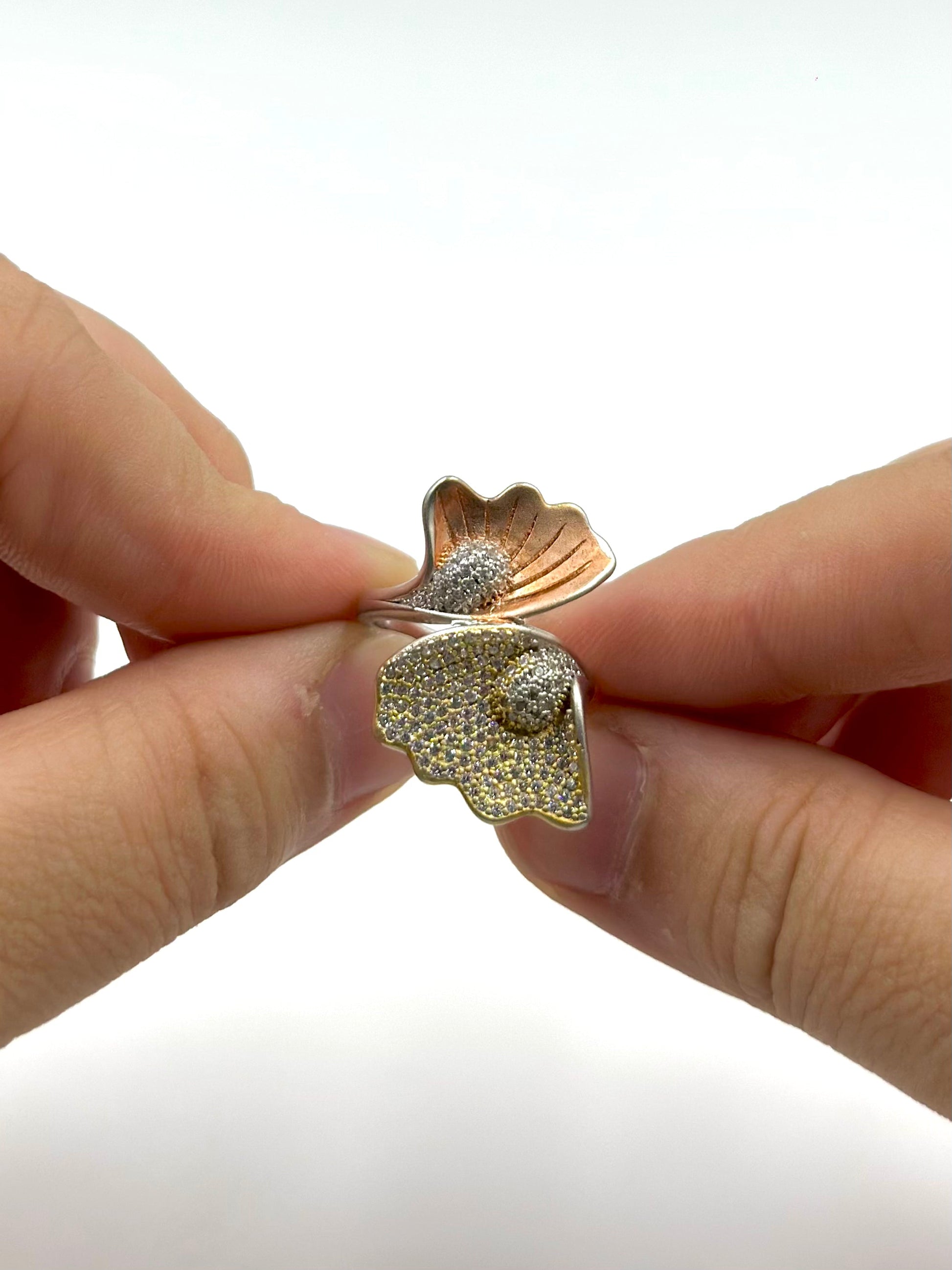 Zircon studded, wings shaped sterling silver cocktail ring 