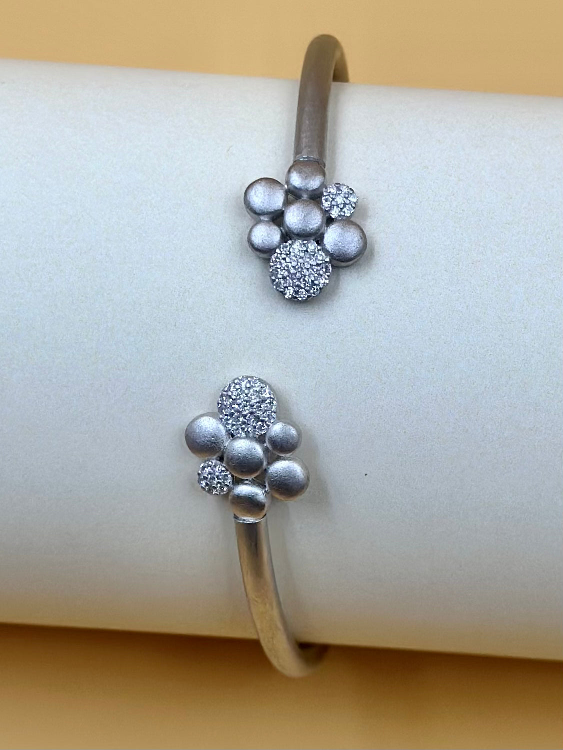 Zircon studded, flower shaped sterling silver cuff bracelet