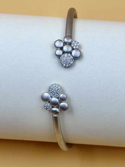 Zircon studded, flower shaped sterling silver cuff bracelet