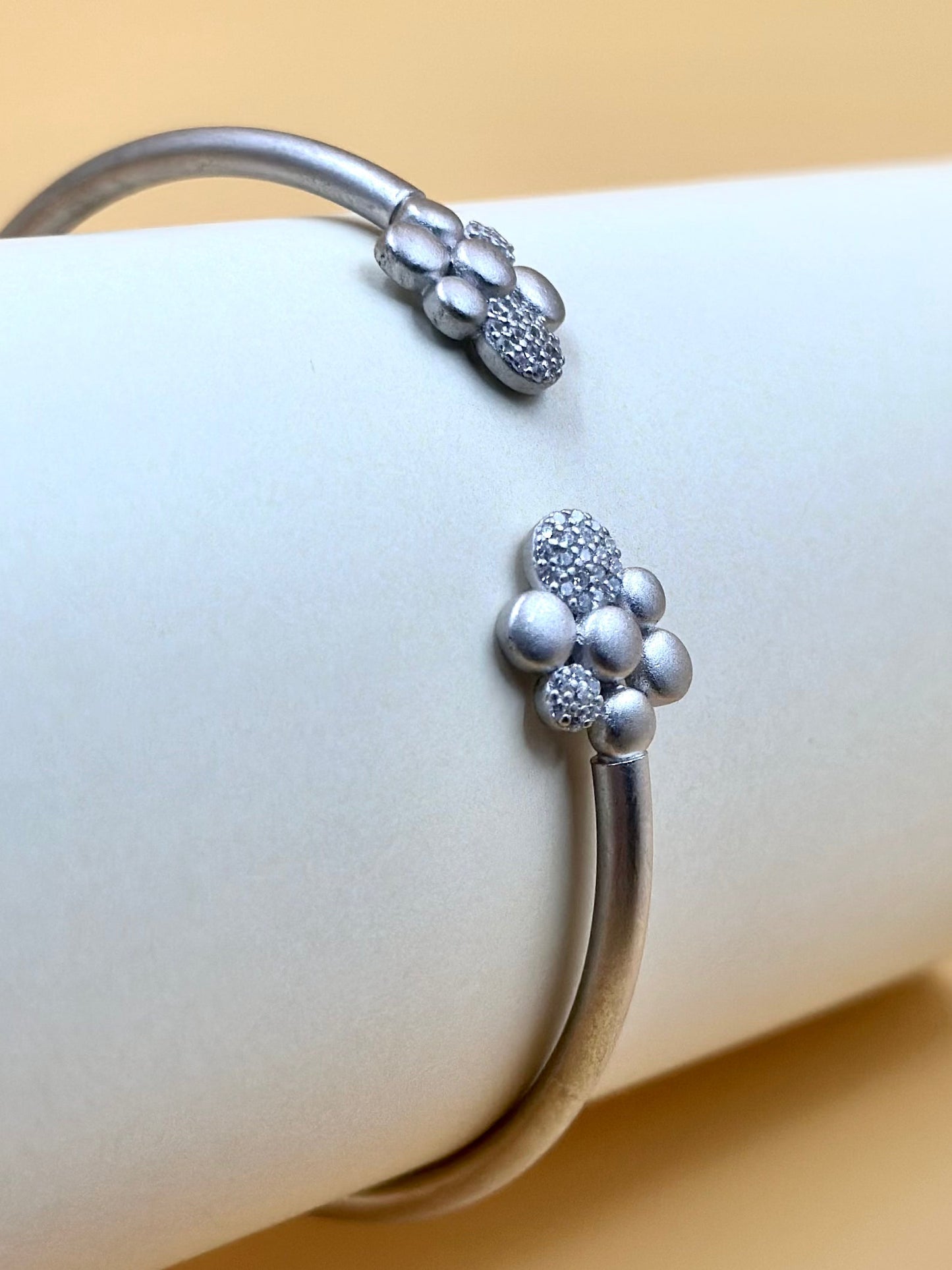 Zircon studded, flower shaped sterling silver cuff bracelet