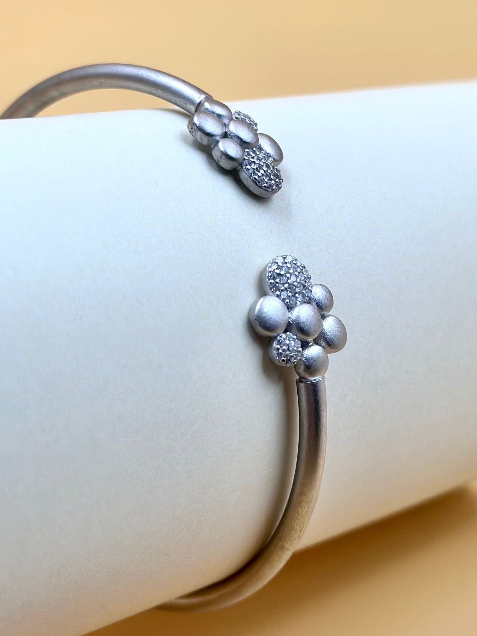 Zircon studded, flower shaped sterling silver cuff bracelet