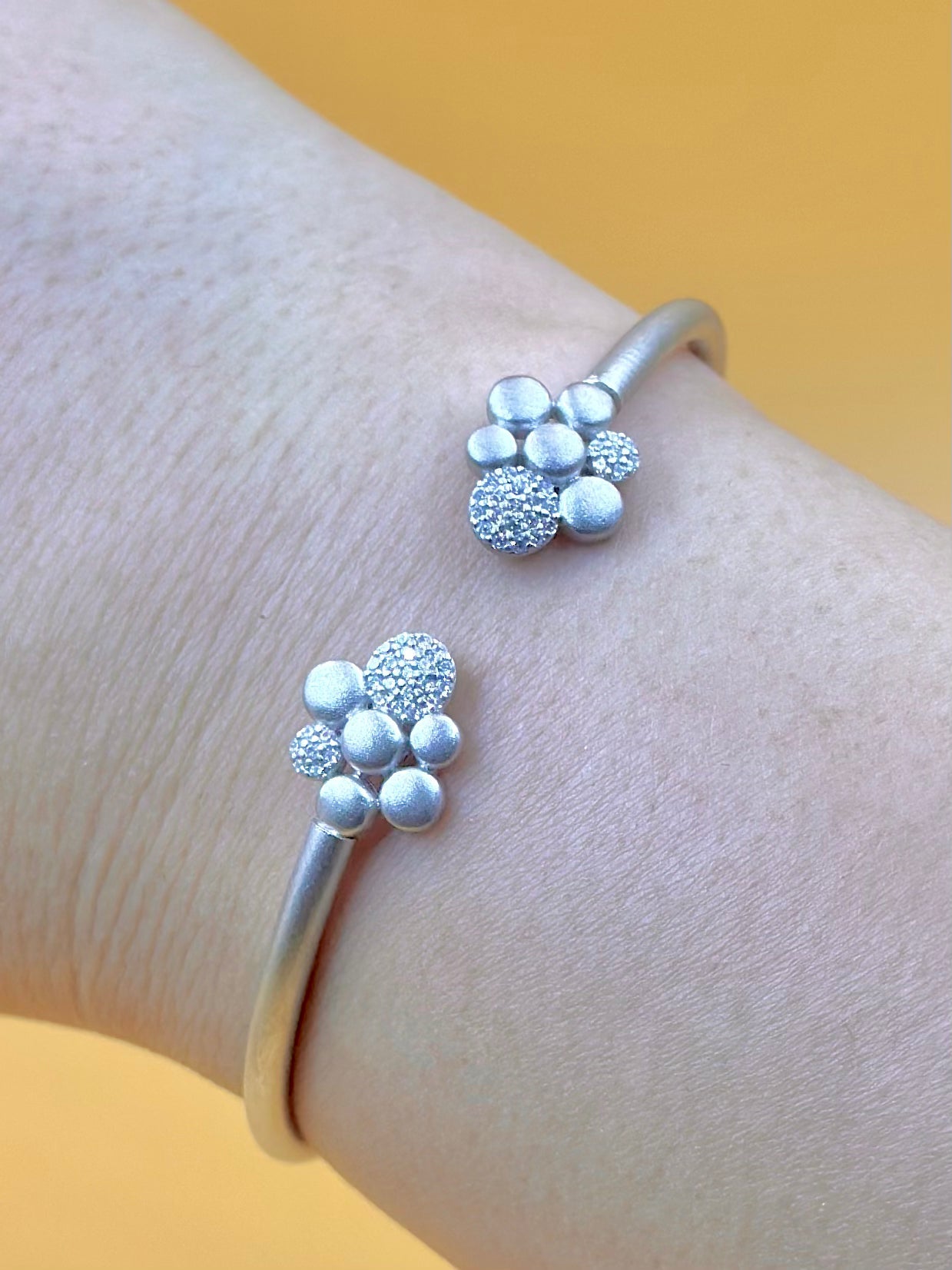 Zircon studded, flower shaped sterling silver cuff bracelet