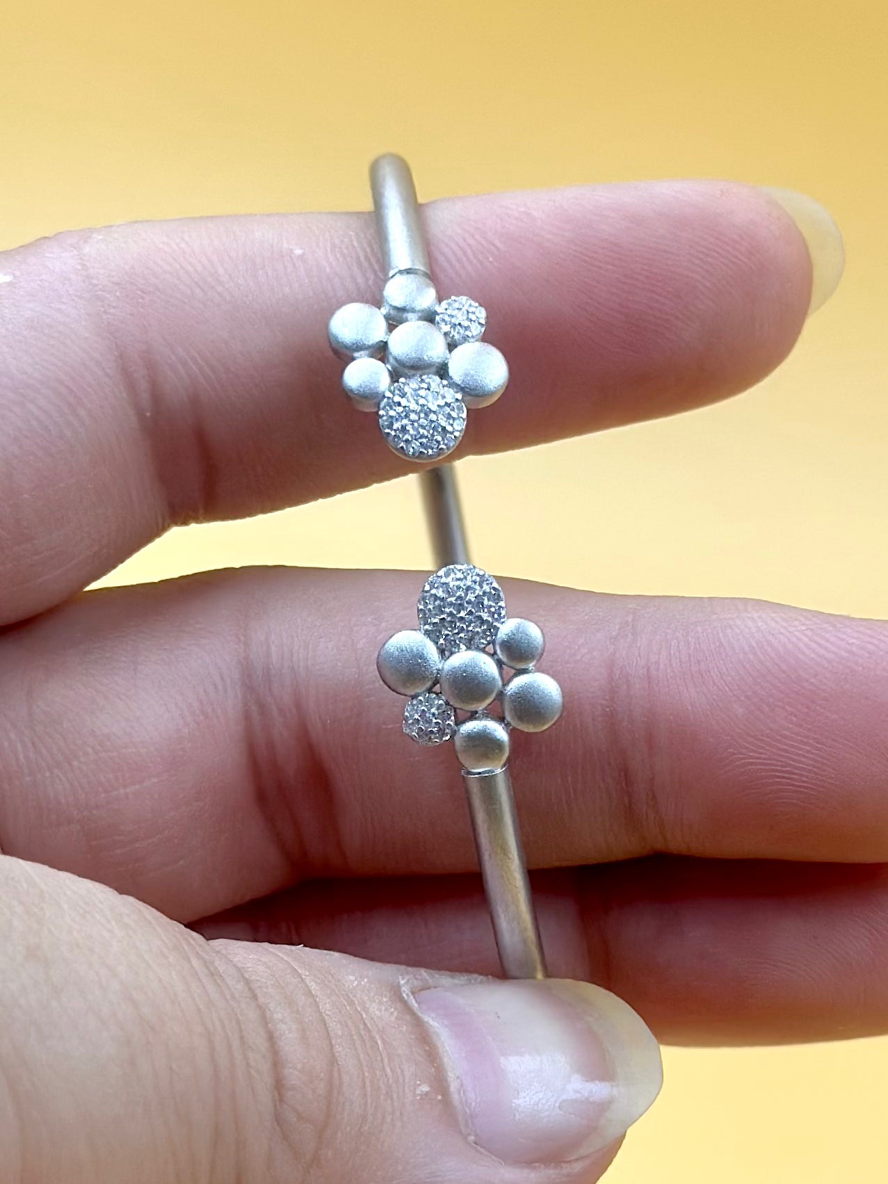 Zircon studded, flower shaped sterling silver cuff bracelet