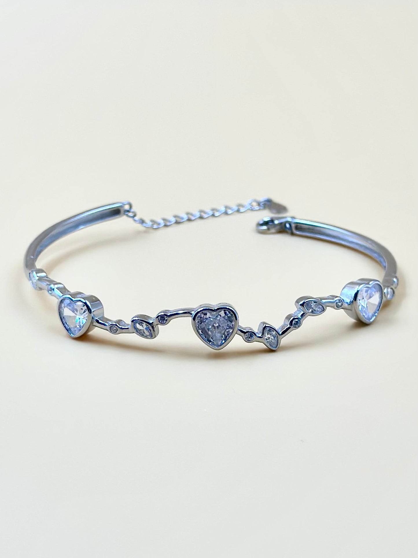 Heart shaped stones studded sterling silver cuff bracelet