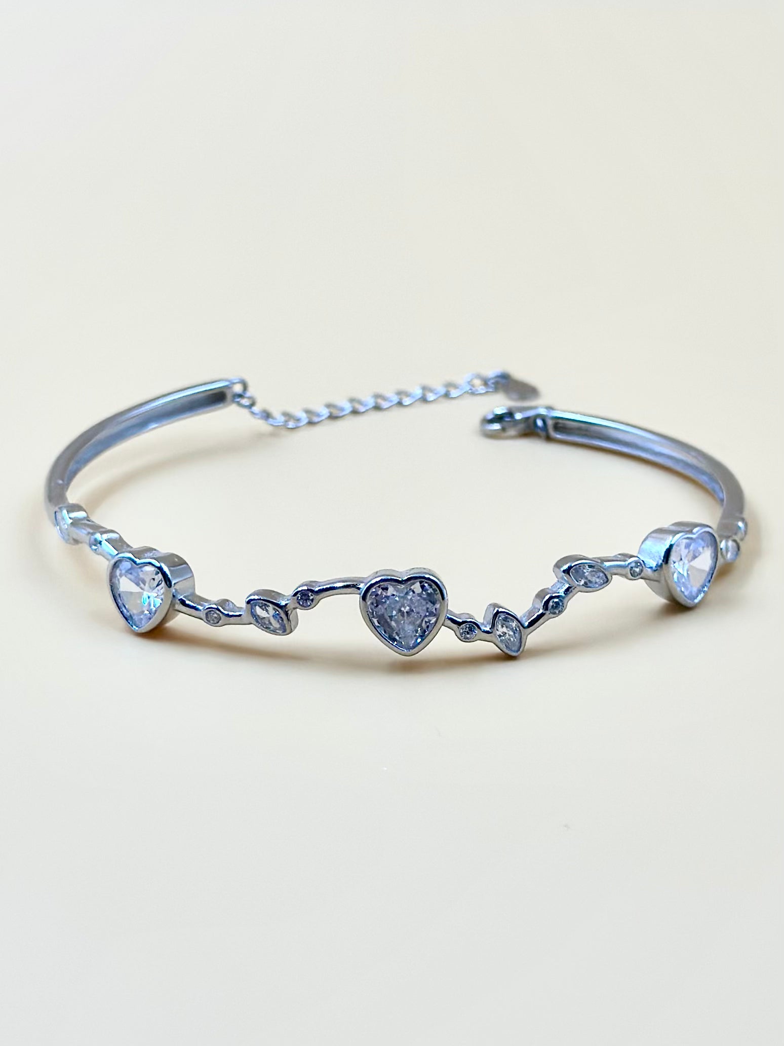 Heart shaped stones studded sterling silver cuff bracelet