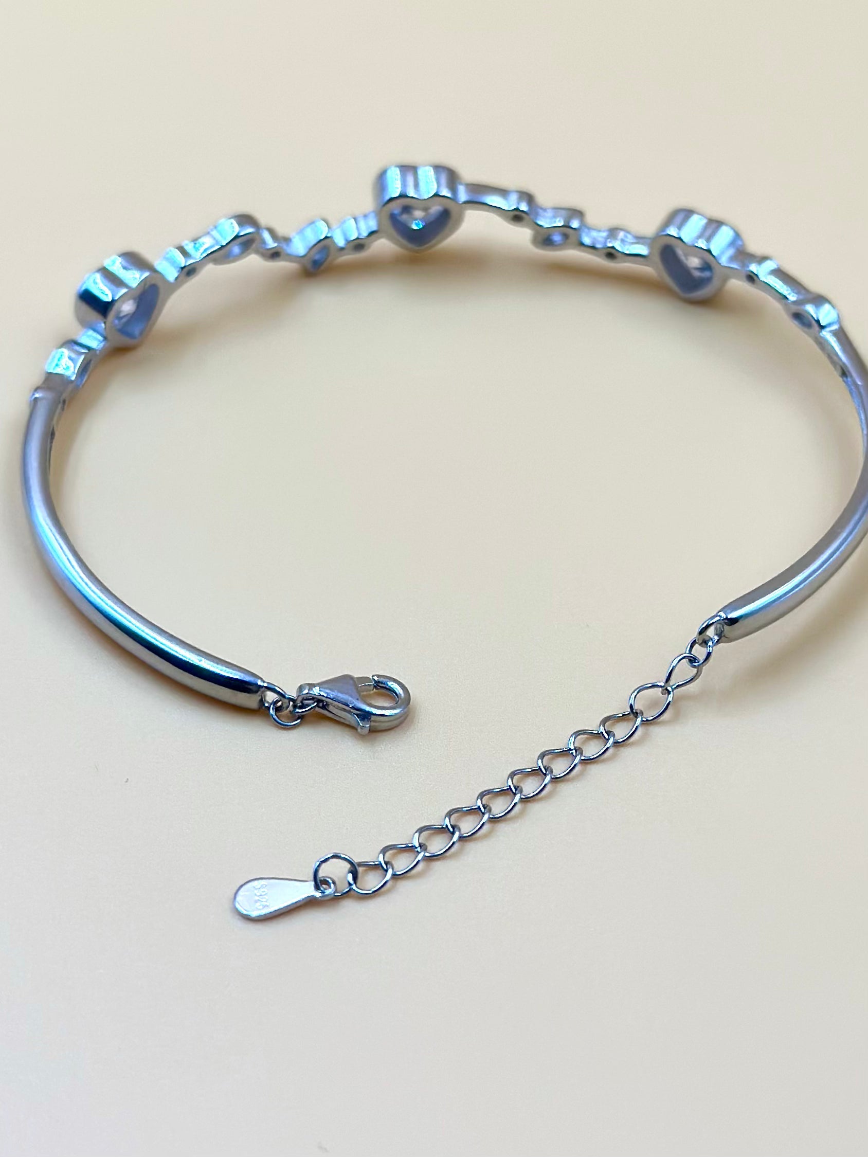 Heart shaped stones studded sterling silver cuff bracelet