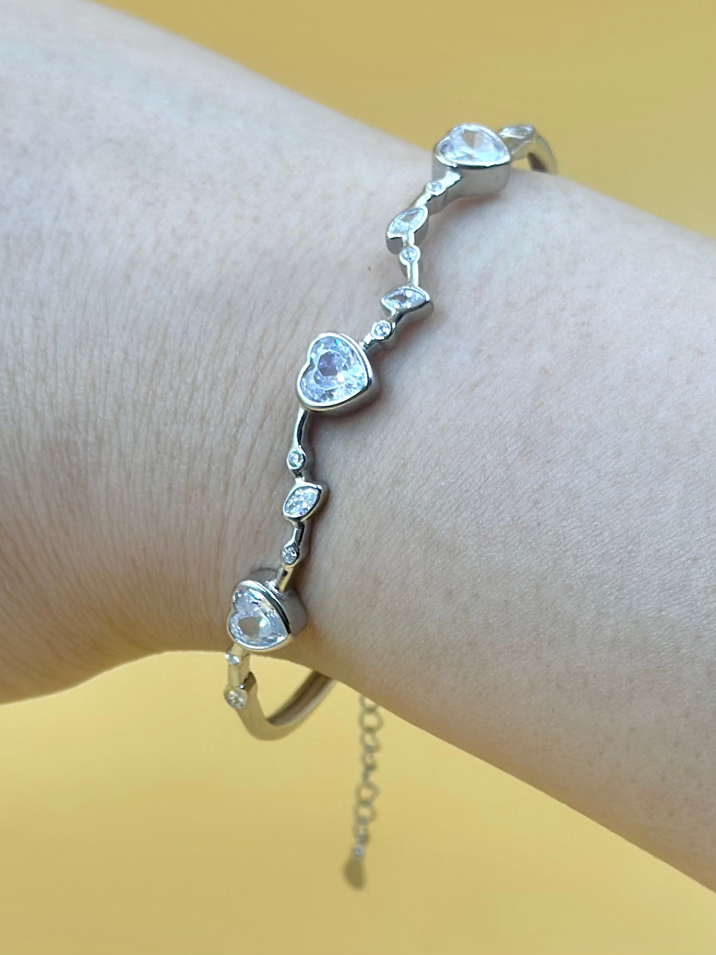 Heart shaped stones studded sterling silver cuff bracelet