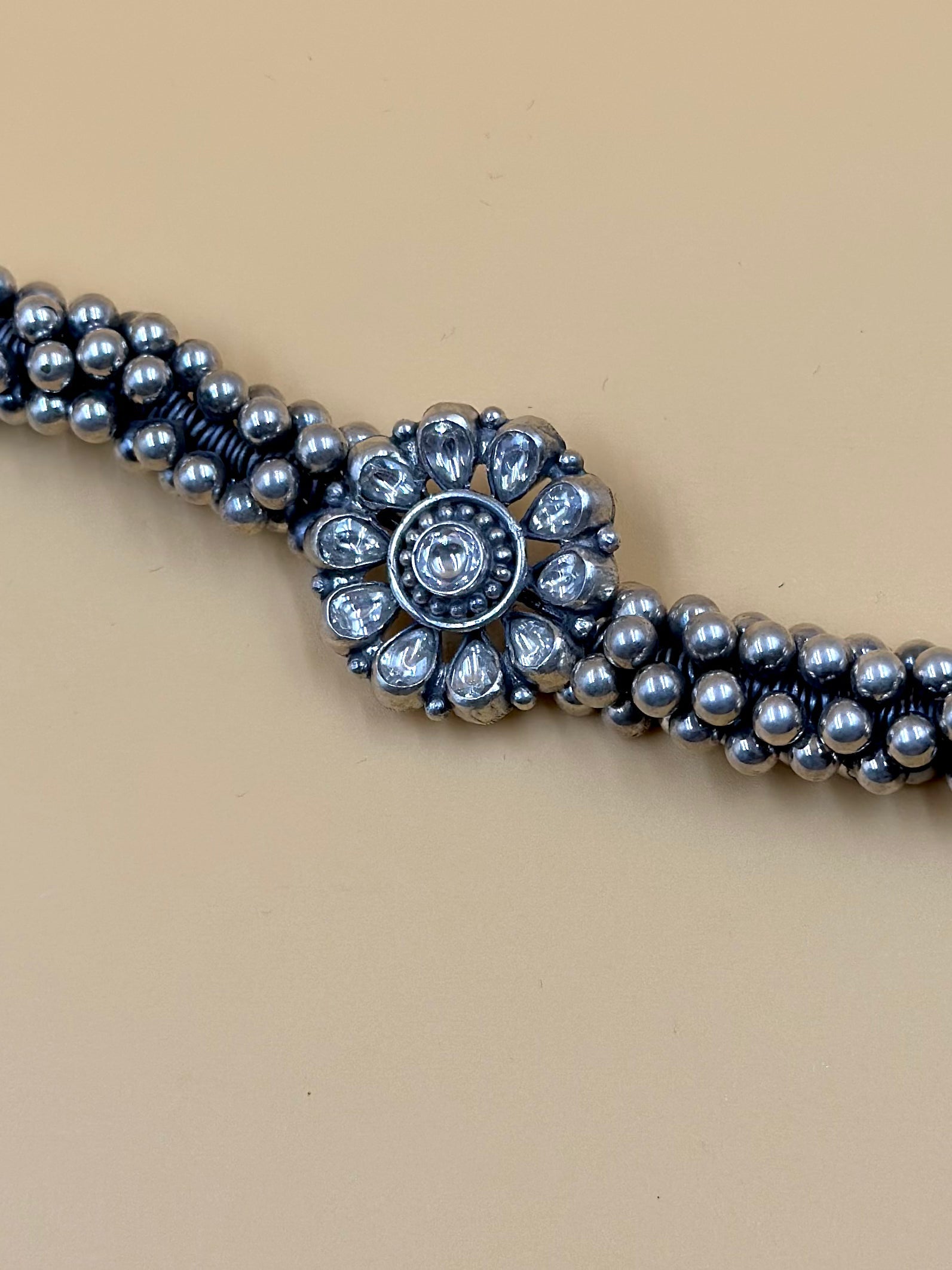 Stone studded, flower shaped sterling silver link bracelet