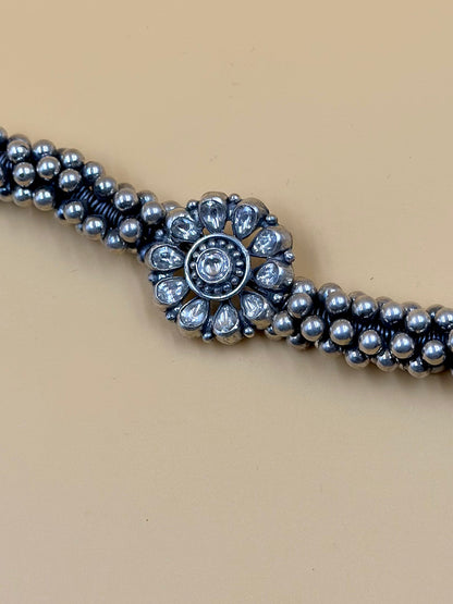 Stone studded, flower shaped sterling silver link bracelet