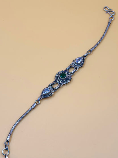 Oxidised, enamel coated, flower shaped sterling silver link bracelet