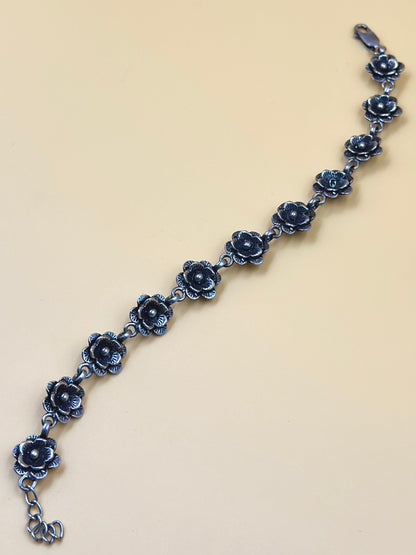 Oxidised, rose shaped sterling silver link bracelet