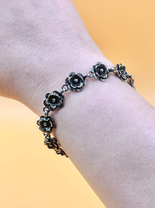 Oxidised, rose shaped sterling silver link bracelet