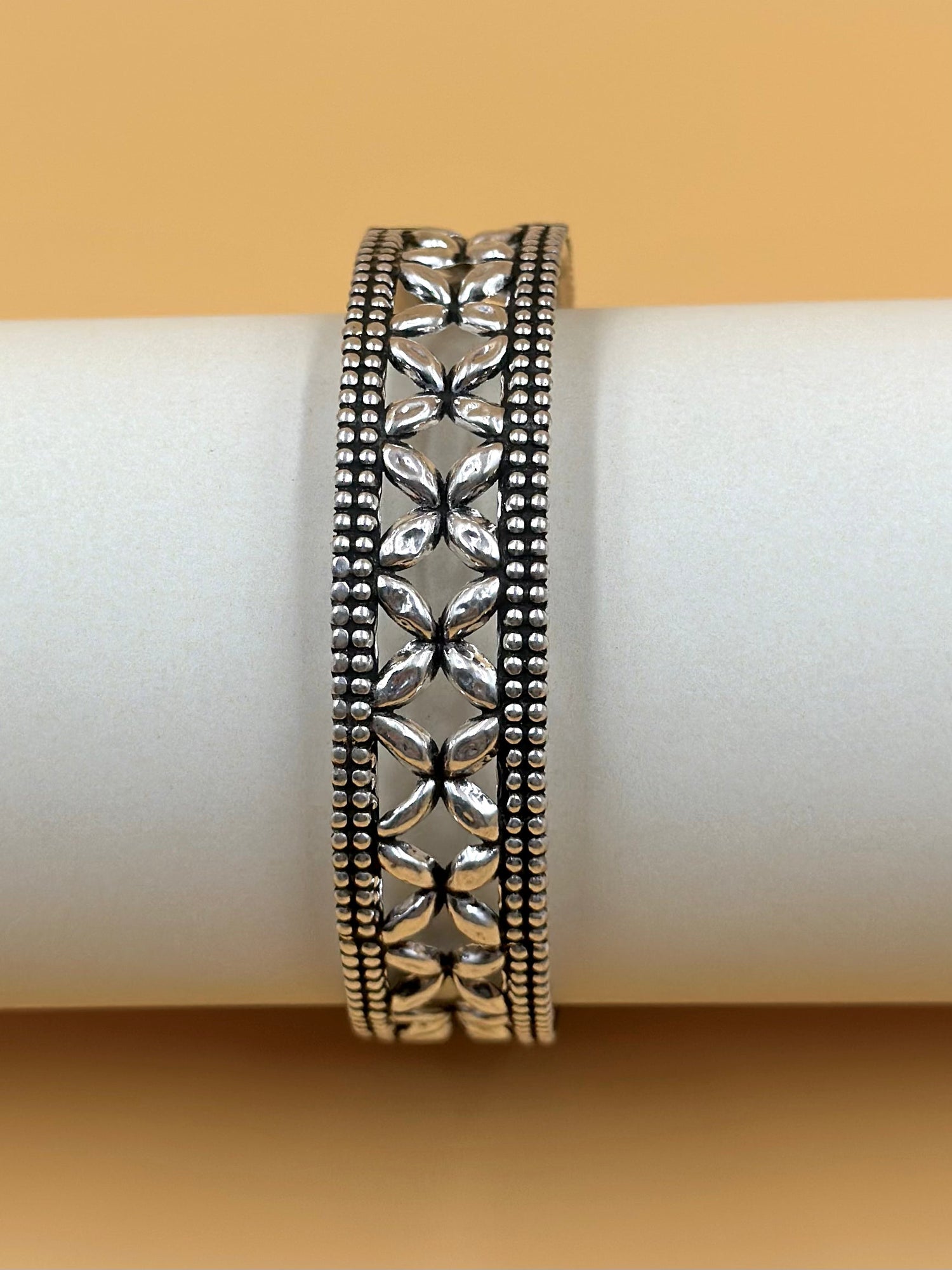 Oxidised, flower shaped sterling silver kada