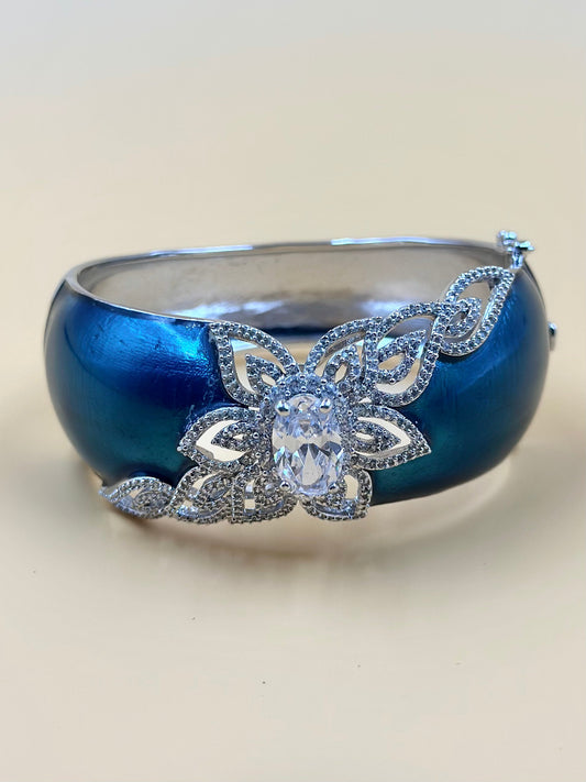 Zircon and a stone studded, flower design sterling silver cuff bracelet