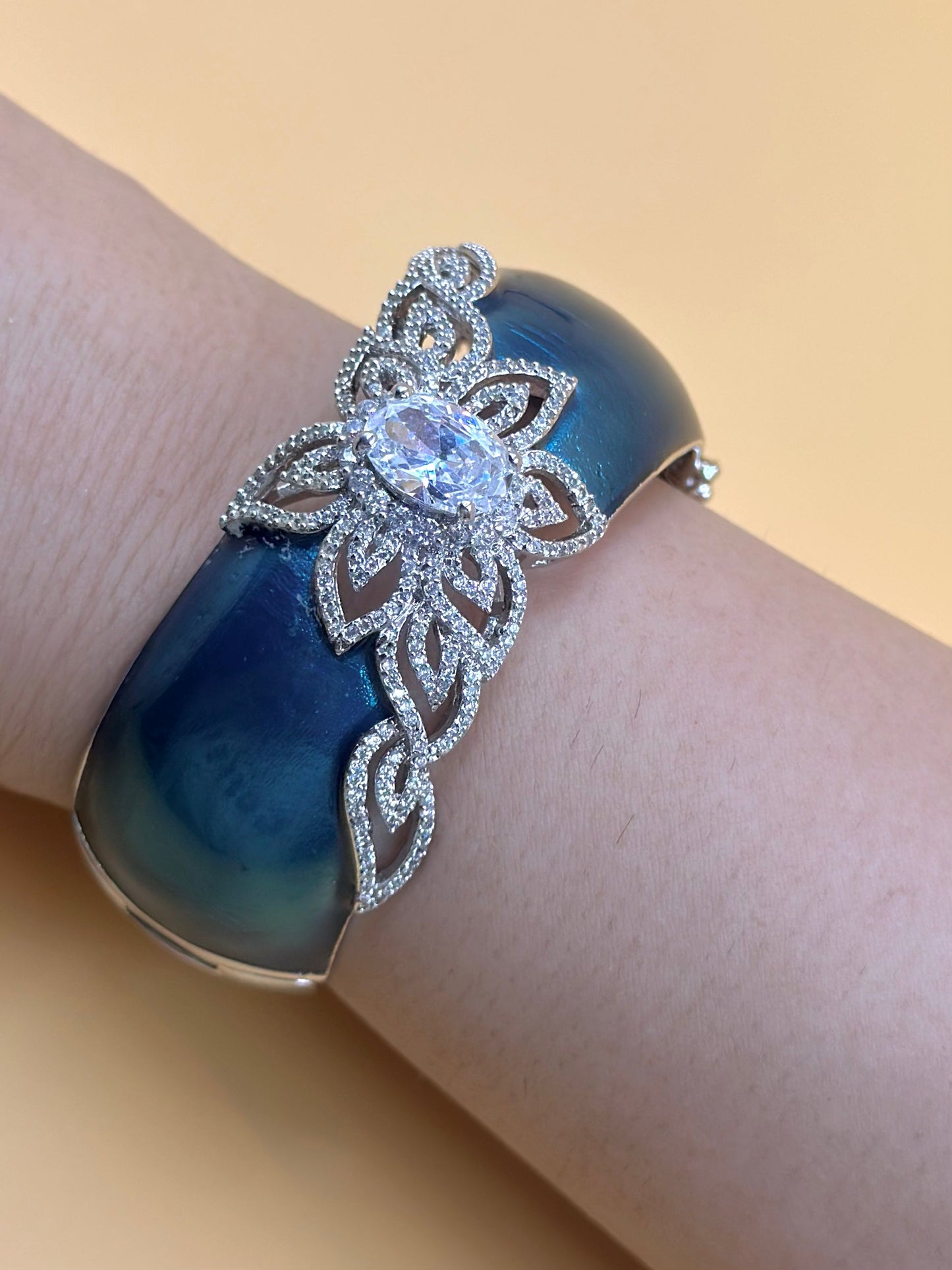 Zircon and a stone studded, flower design sterling silver cuff bracelet