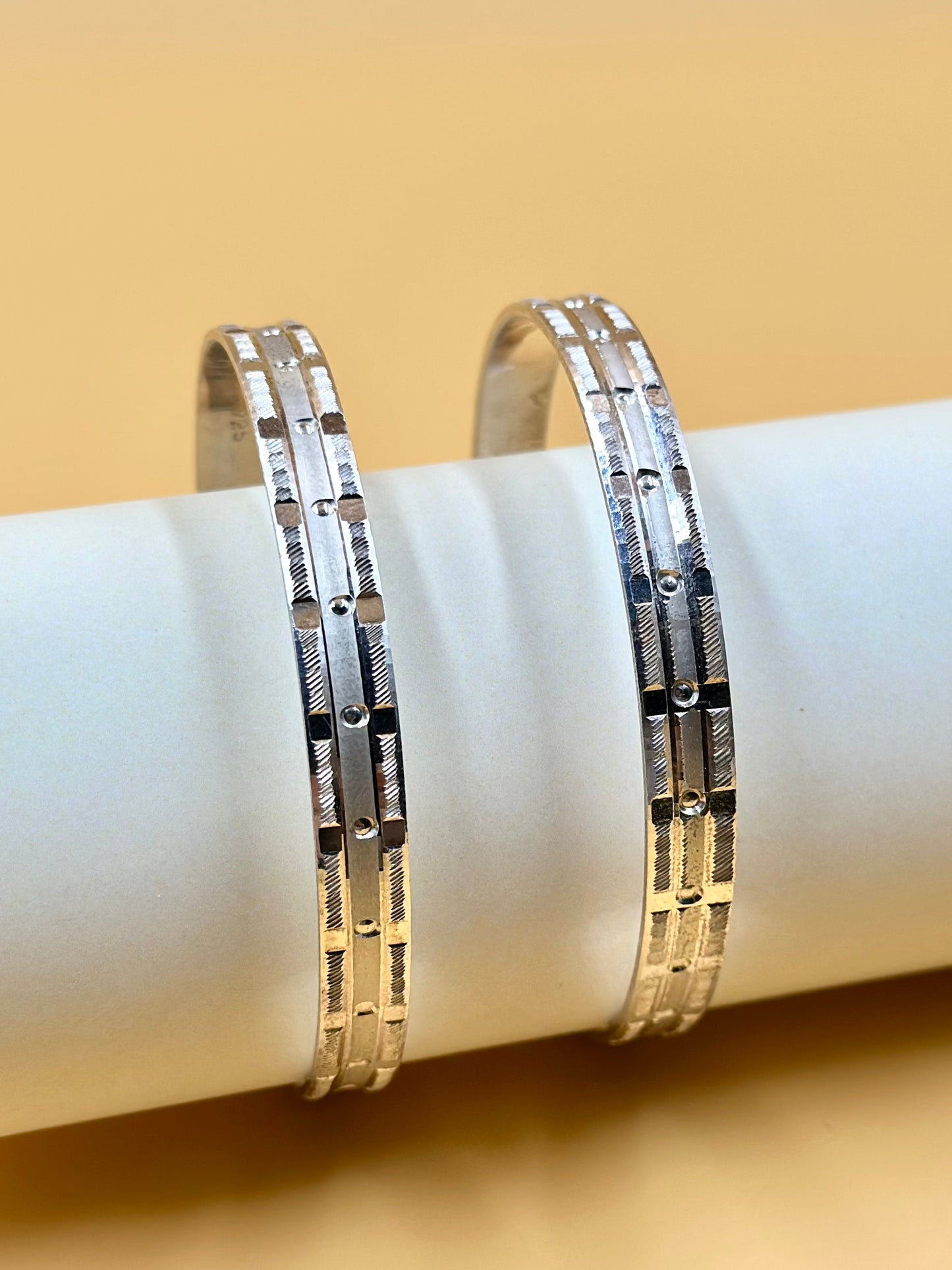 Small rectangular panels and textured pattern sterling silver bangle