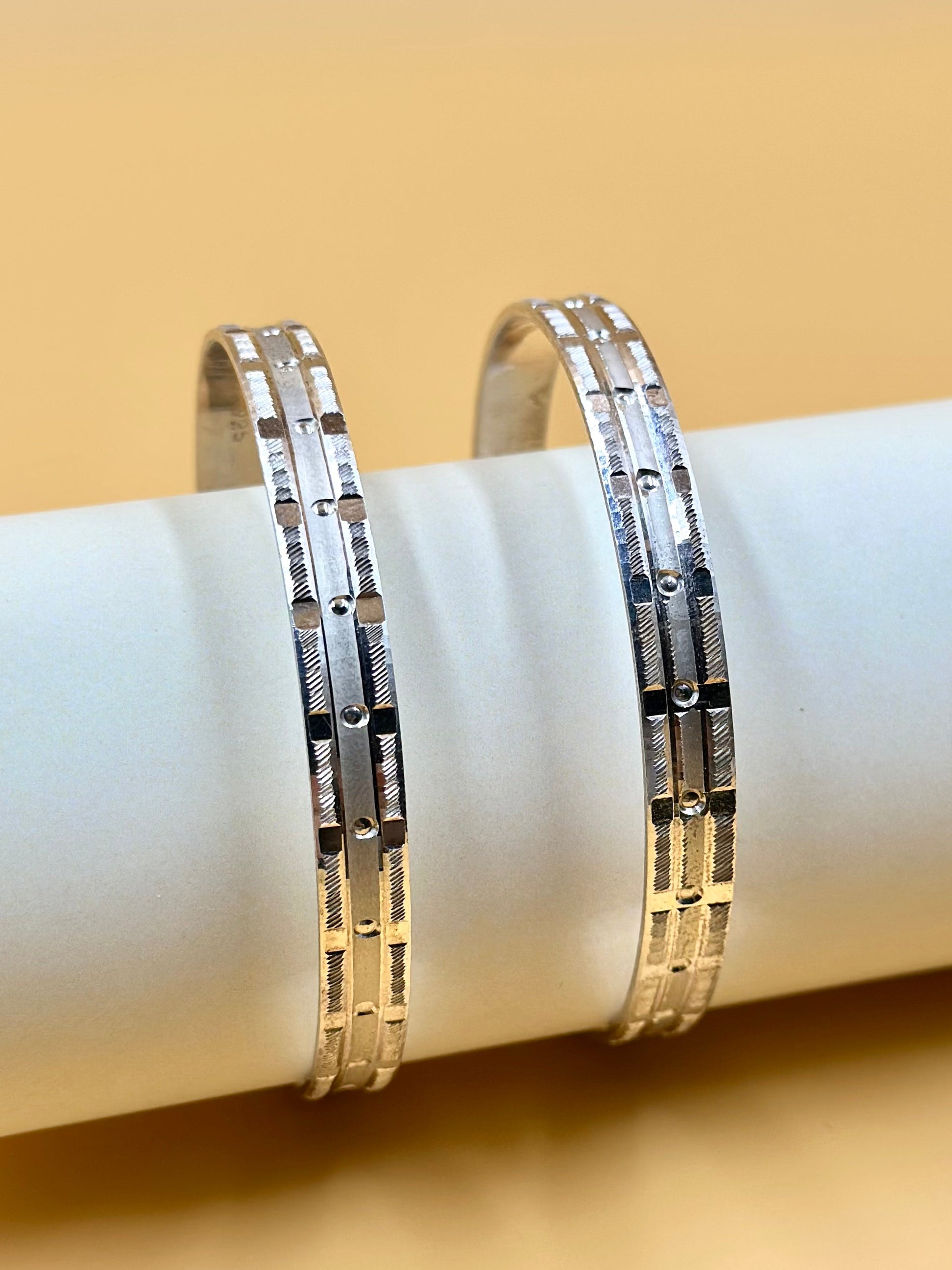 Small rectangular panels and textured pattern sterling silver bangle