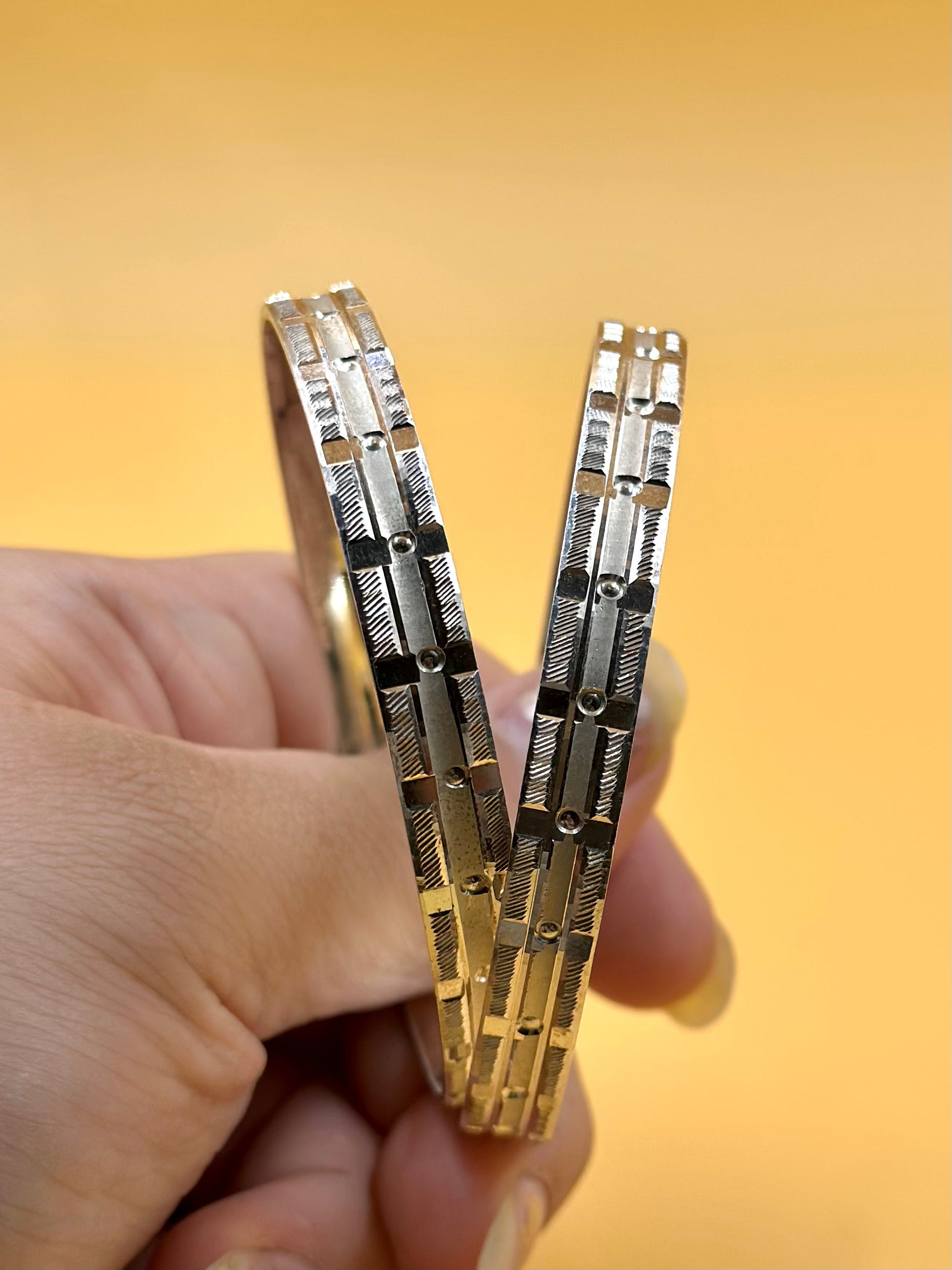 Small rectangular panels and textured pattern sterling silver bangle