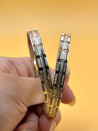 Small rectangular panels and textured pattern sterling silver bangle